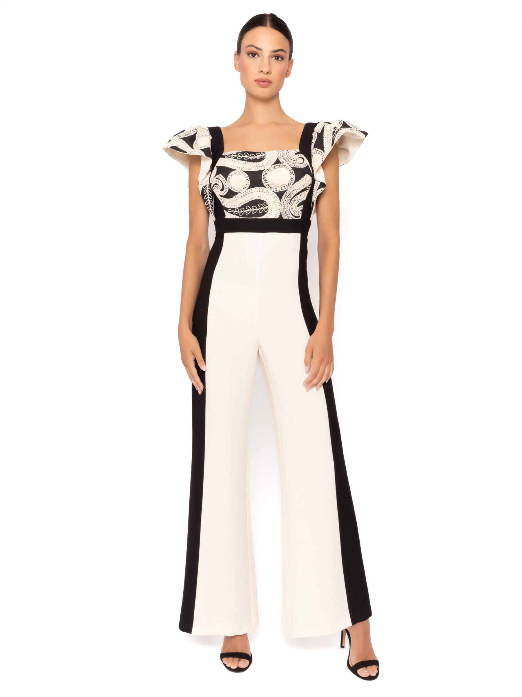 Arggido 49566 jumpsuit in monochrome with square neckline, frill sleeves and wide leg trousers.