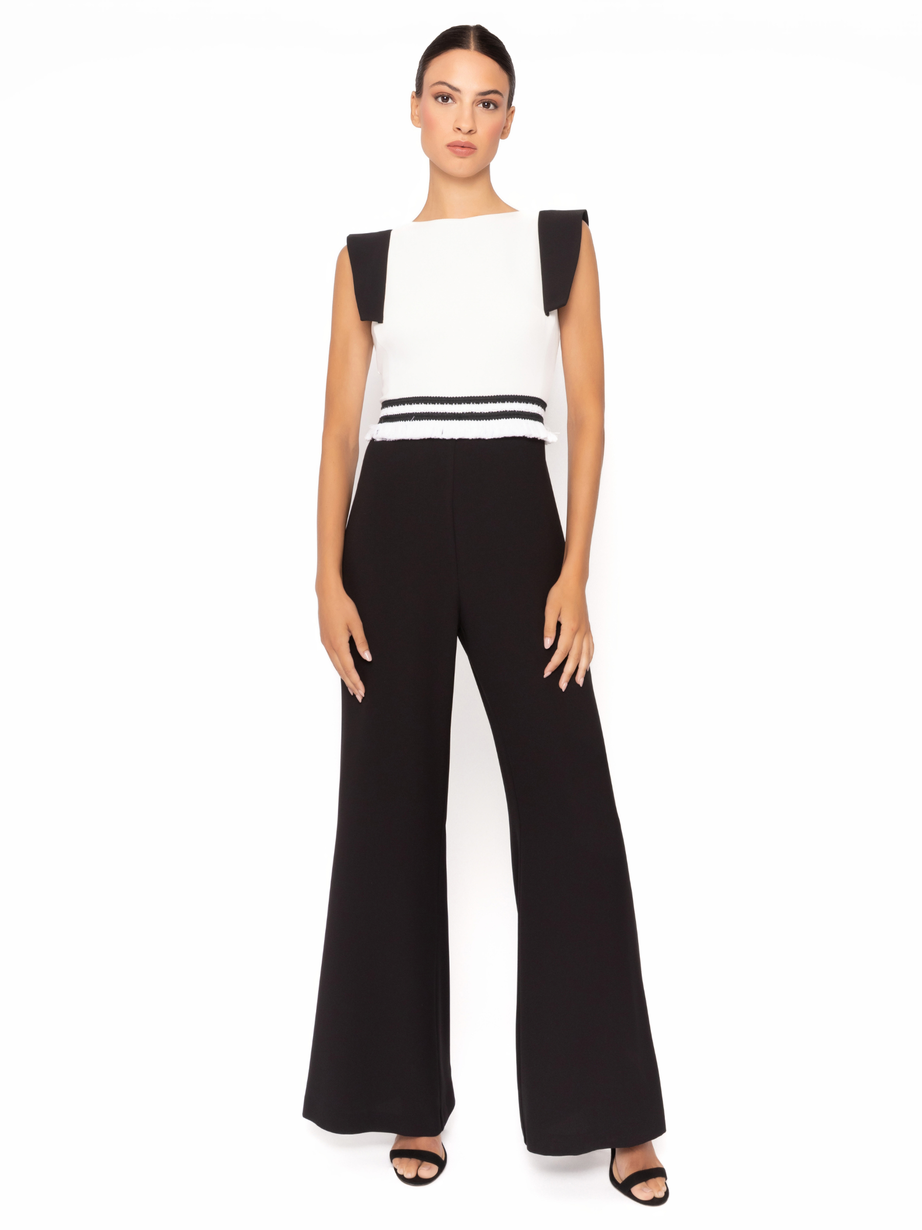 Arggido 49583 fringe jumpsuit with structured shoulders, fringe waist detail and wide leg trousers.
