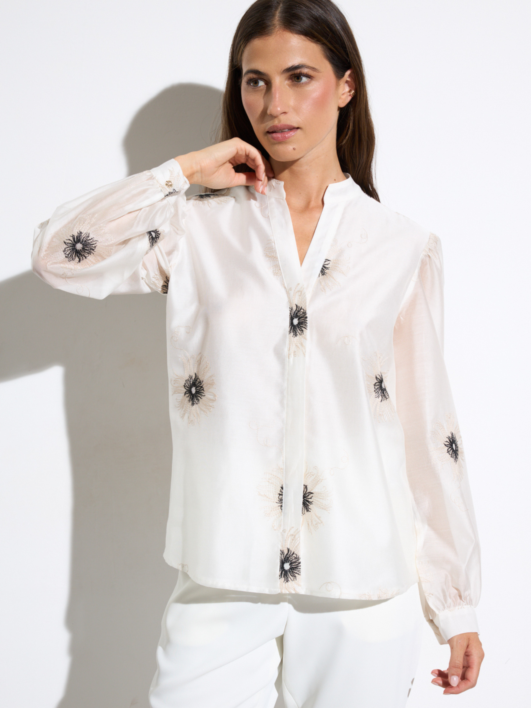 Bariloche Azogue Shirt with notch neckline, concealed button front and long sleeves featuring delicate embroidered detailing in relaxed silhouette.