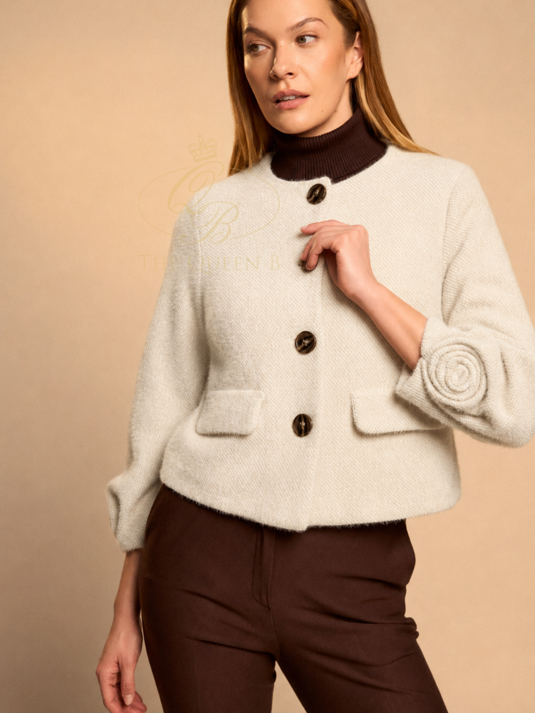Bariloche Marsala Jacket with round neckline, button front, pocket flaps and statement rosette cuff detail