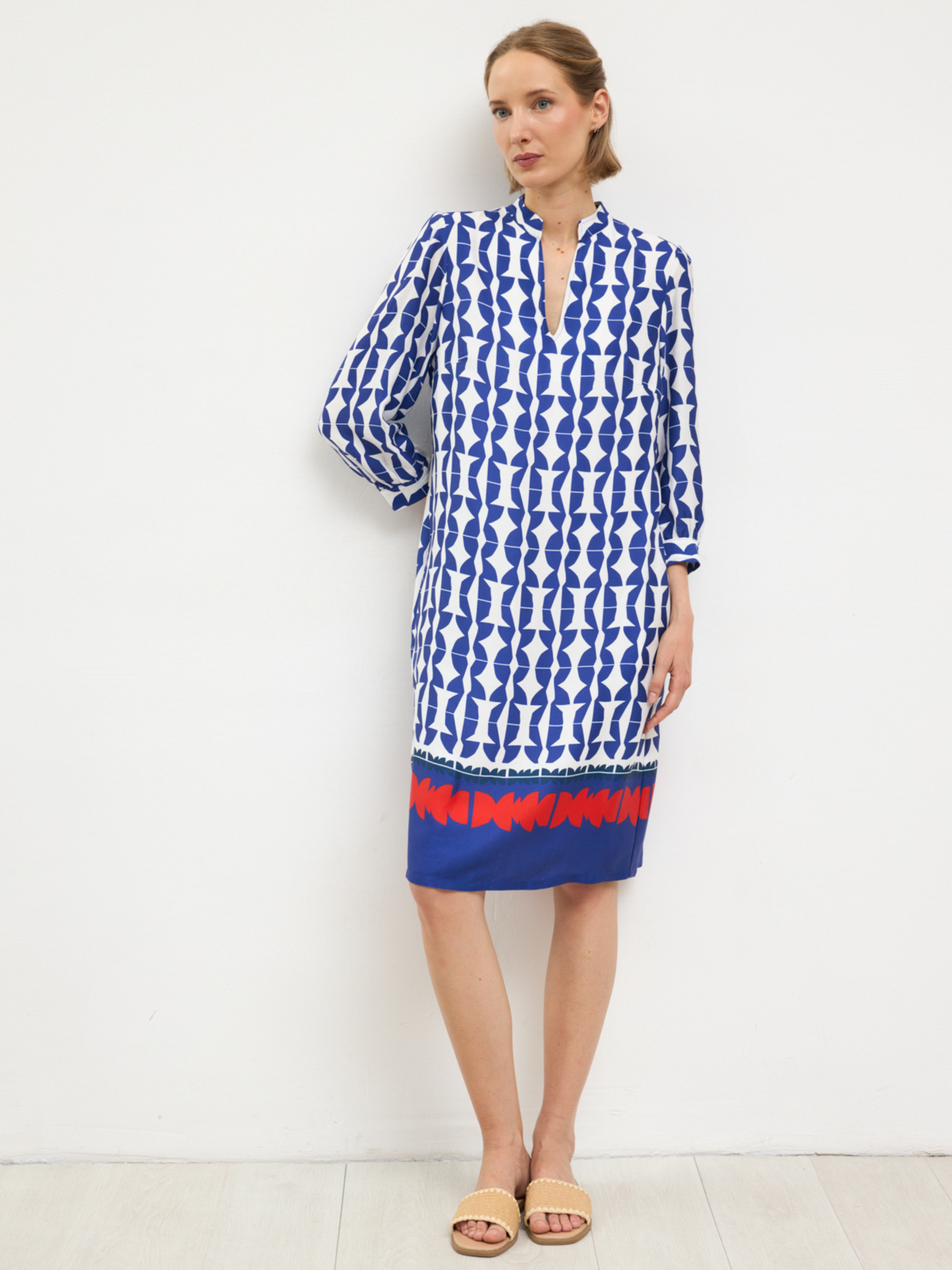 Bariloche Menta Dress with notch neckline, three-quarter sleeves and tailored knee-length shift silhouette in geometric print design.