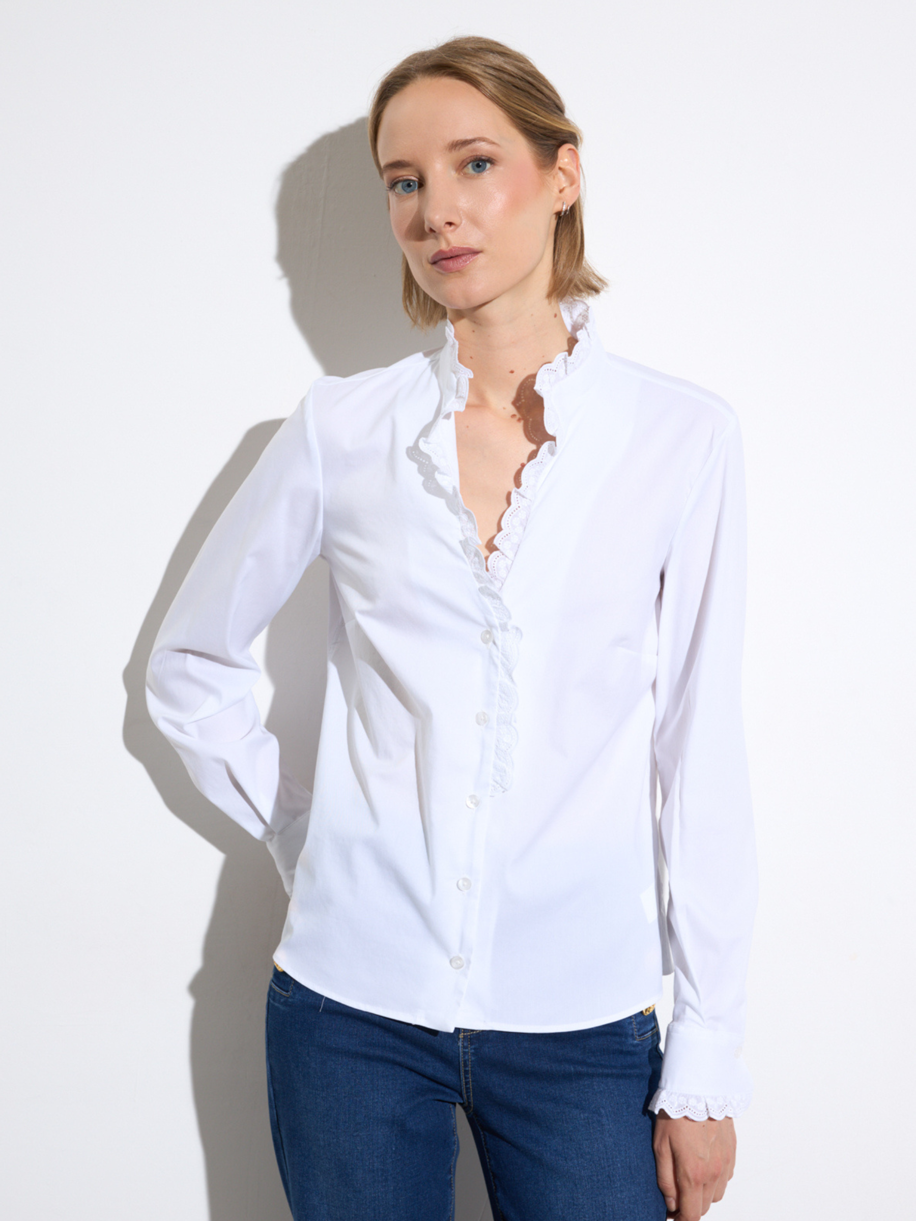 Bariloche Troya Shirt with scalloped lace trim neckline, button-through front and long sleeves in tailored fitted silhouette.