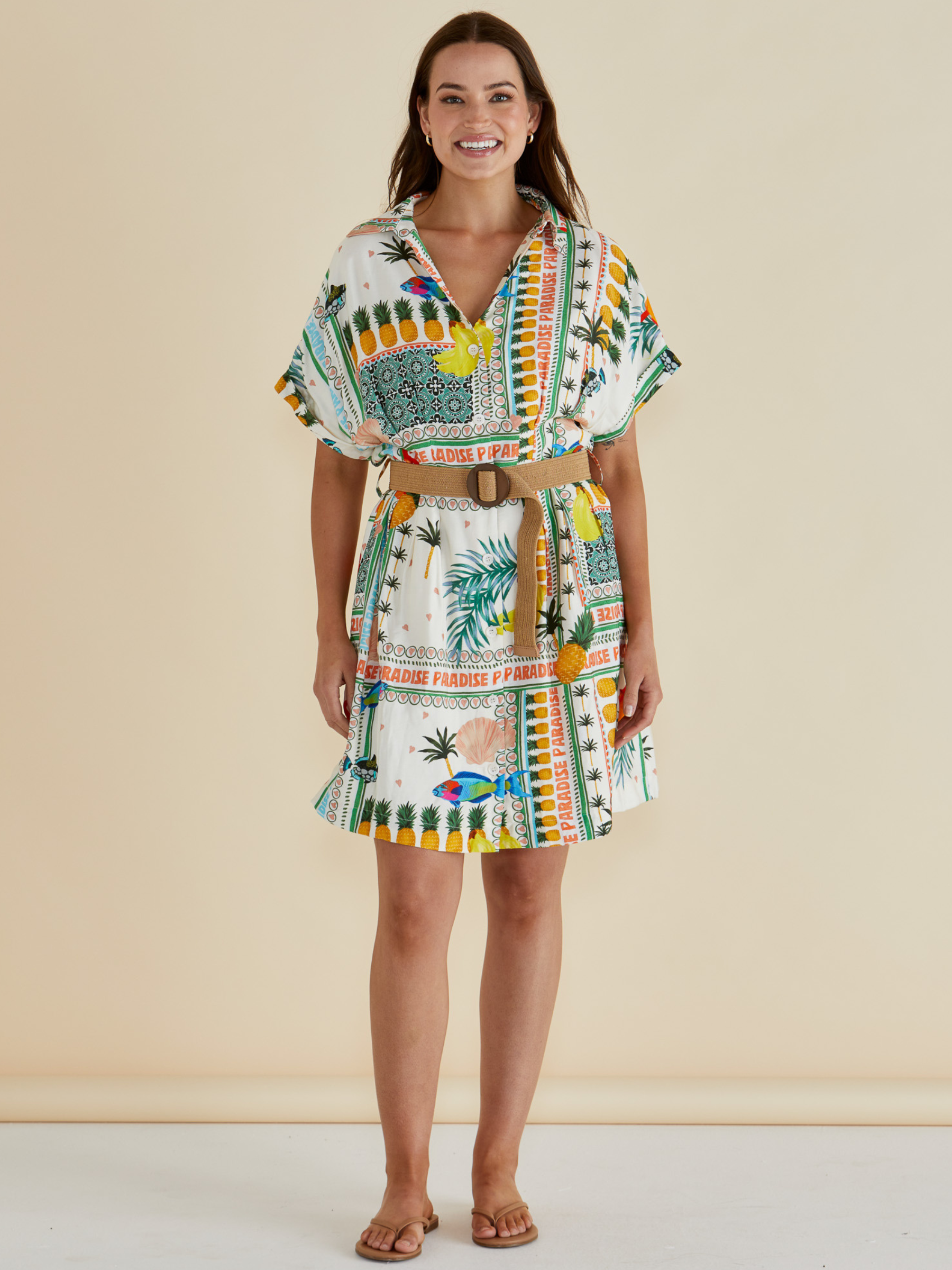 Betty Archer Dress with short sleeves, button-through front, detachable belt and colourful tropical “Paradise” patchwork print.