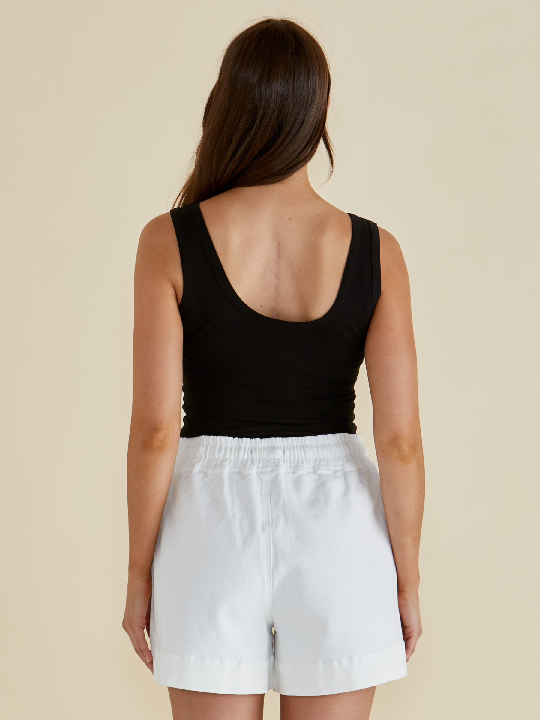 Betty Emma Scoop Tank with scoop neckline, sleeveless fitted silhouette and smooth streamlined design.