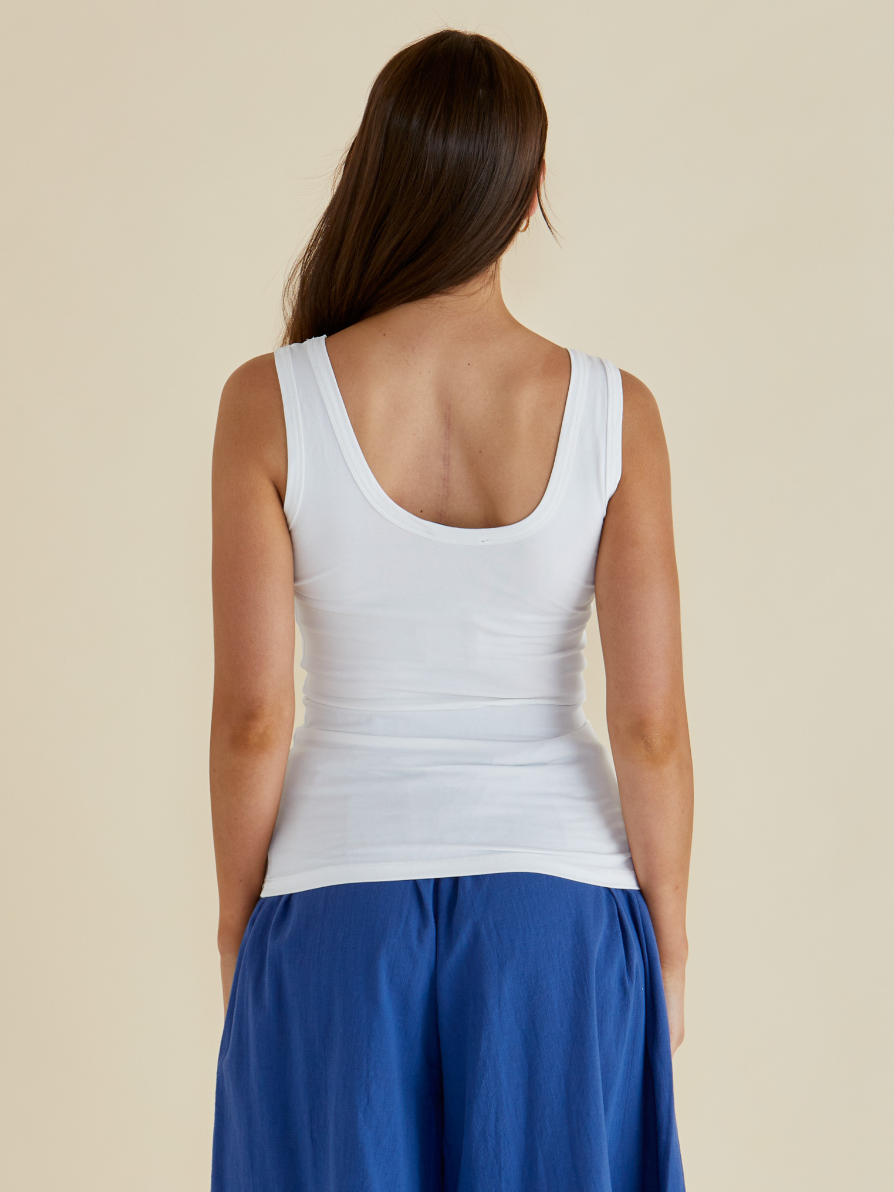 Betty Emma Scoop Tank with scoop neckline, sleeveless fitted silhouette and smooth streamlined design.