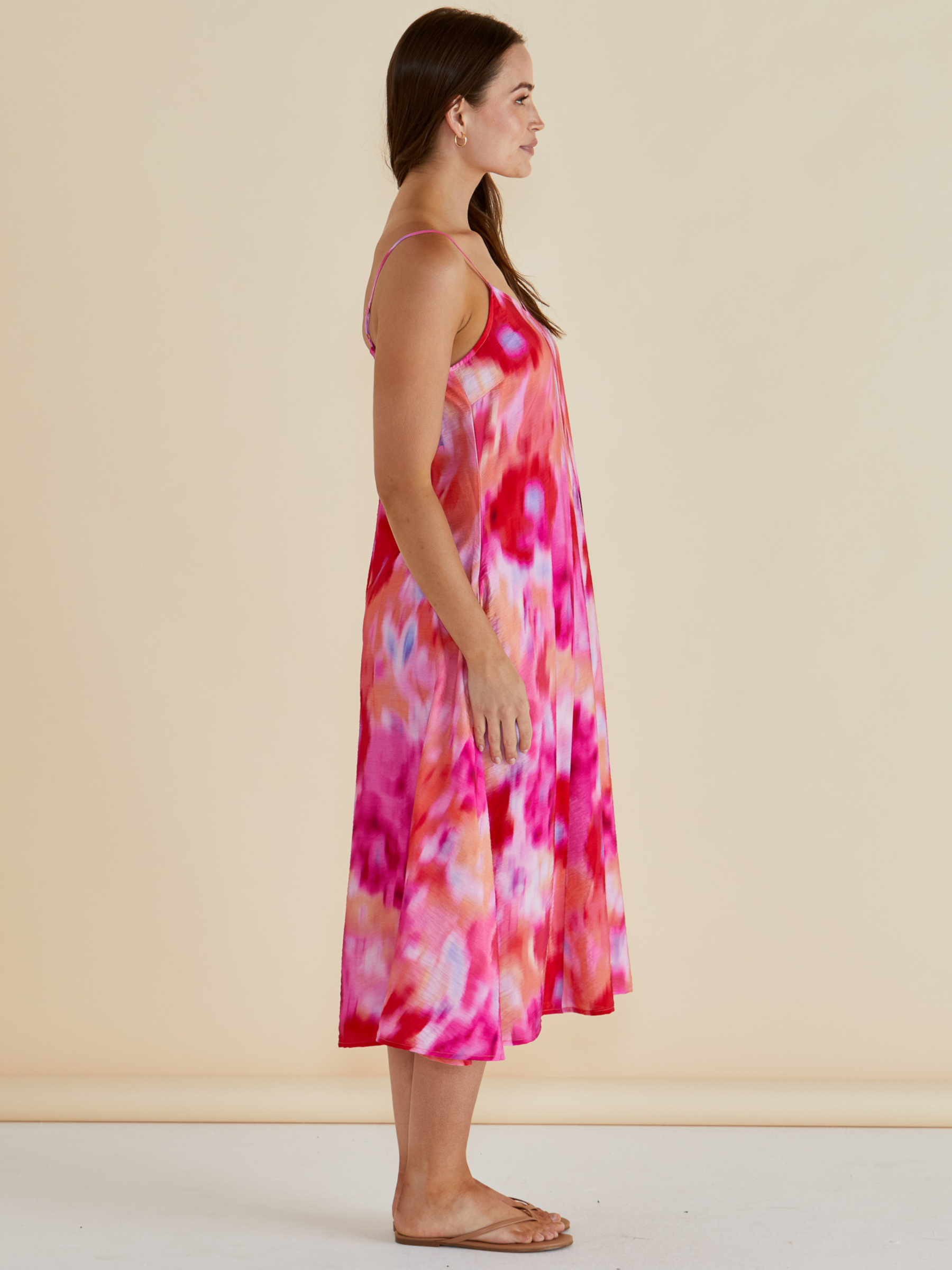 Betty Harriet Dress with draped neckline, adjustable straps and midi-length A-line silhouette.