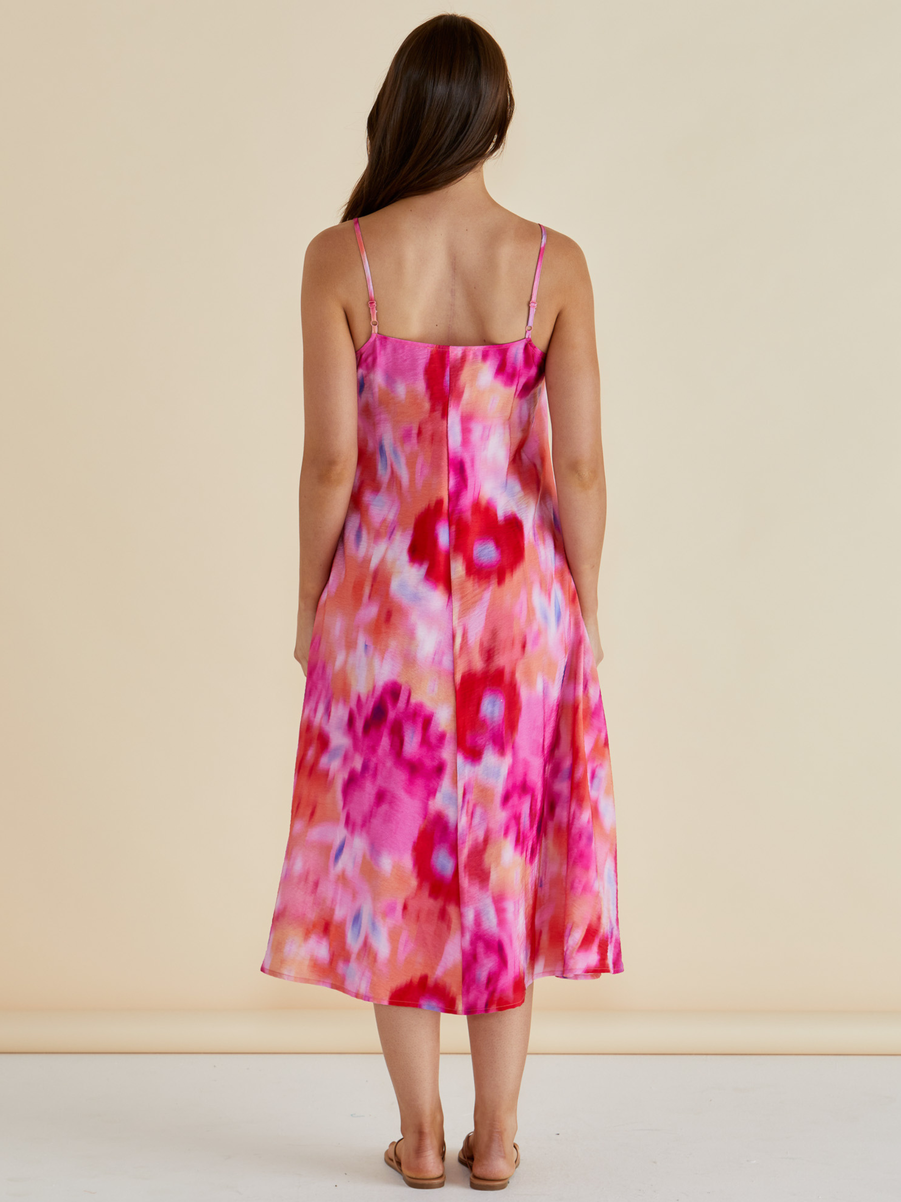 Betty Harriet Dress with draped neckline, adjustable straps and midi-length A-line silhouette.