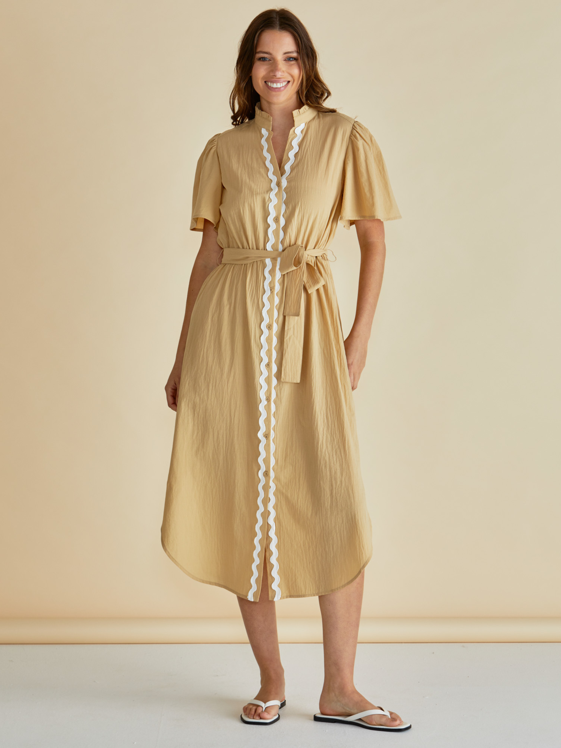 Betty Immie Dress with stand collar, button-through front, flutter sleeves and self-tie waist belt.