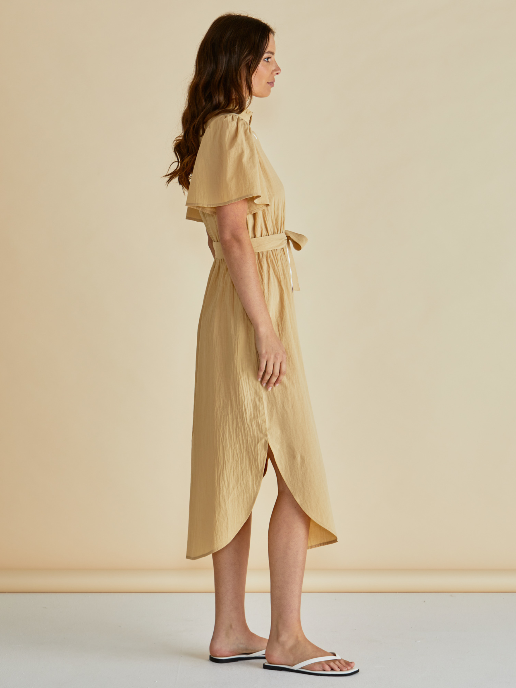 Betty Immie Dress with stand collar, button-through front, flutter sleeves and self-tie waist belt.