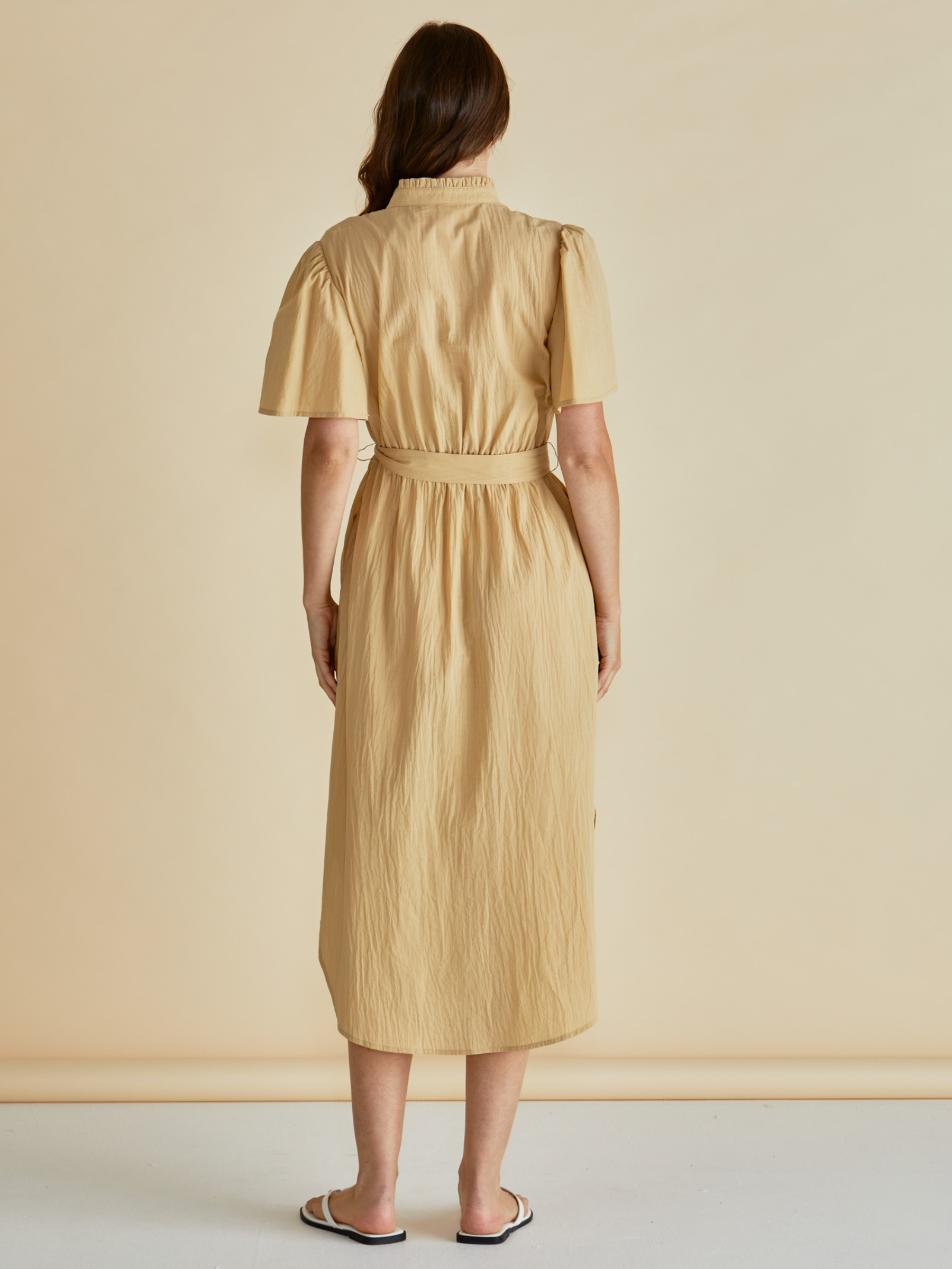 Betty Immie Dress with stand collar, button-through front, flutter sleeves and self-tie waist belt.