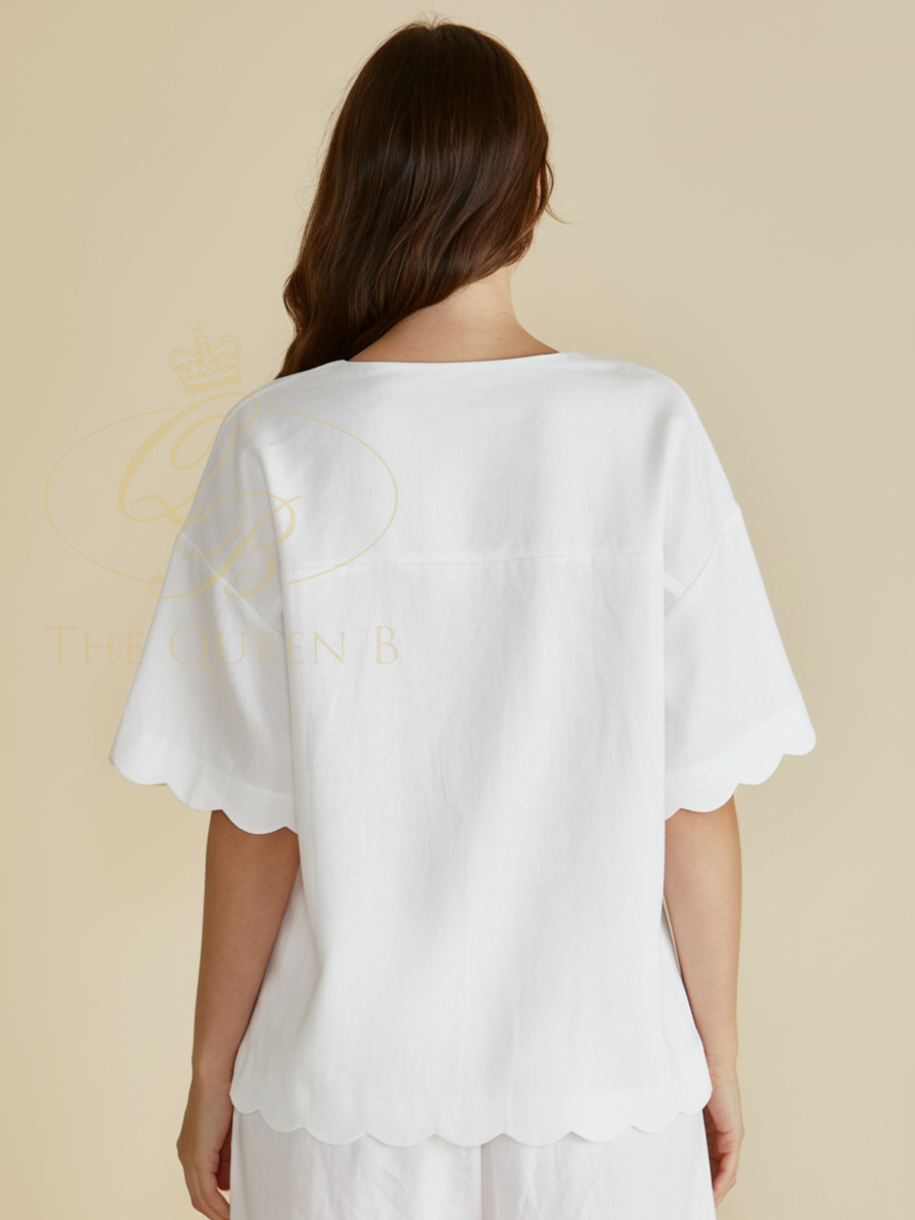 Betty Scarlett Shirt with V neckline, button-through front, short sleeves and scalloped hem.