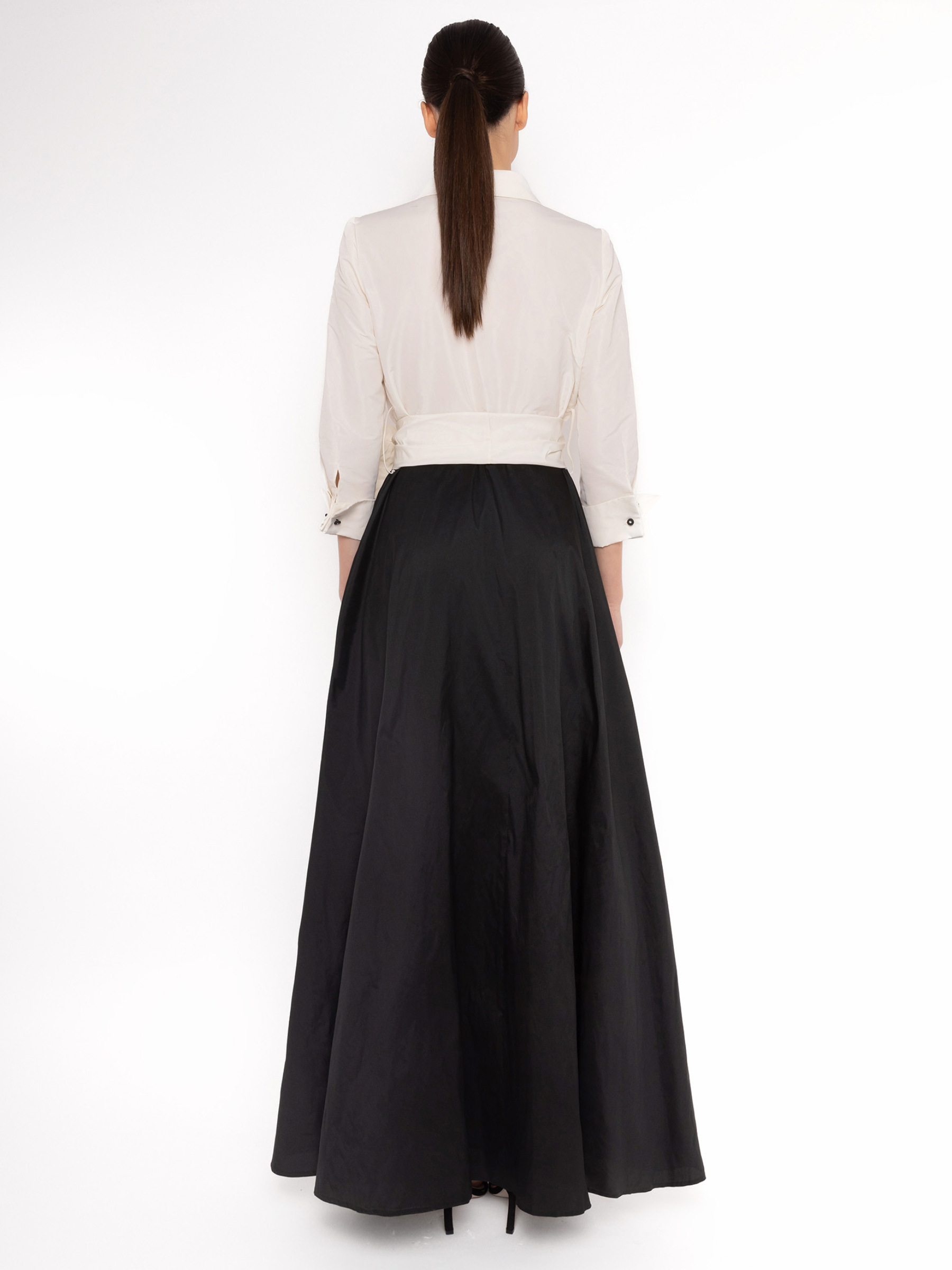 Carla Ruiz 152502 white and black dress with plunging V-neck bodice, tie waist sash and flowing A-line maxi skirt.