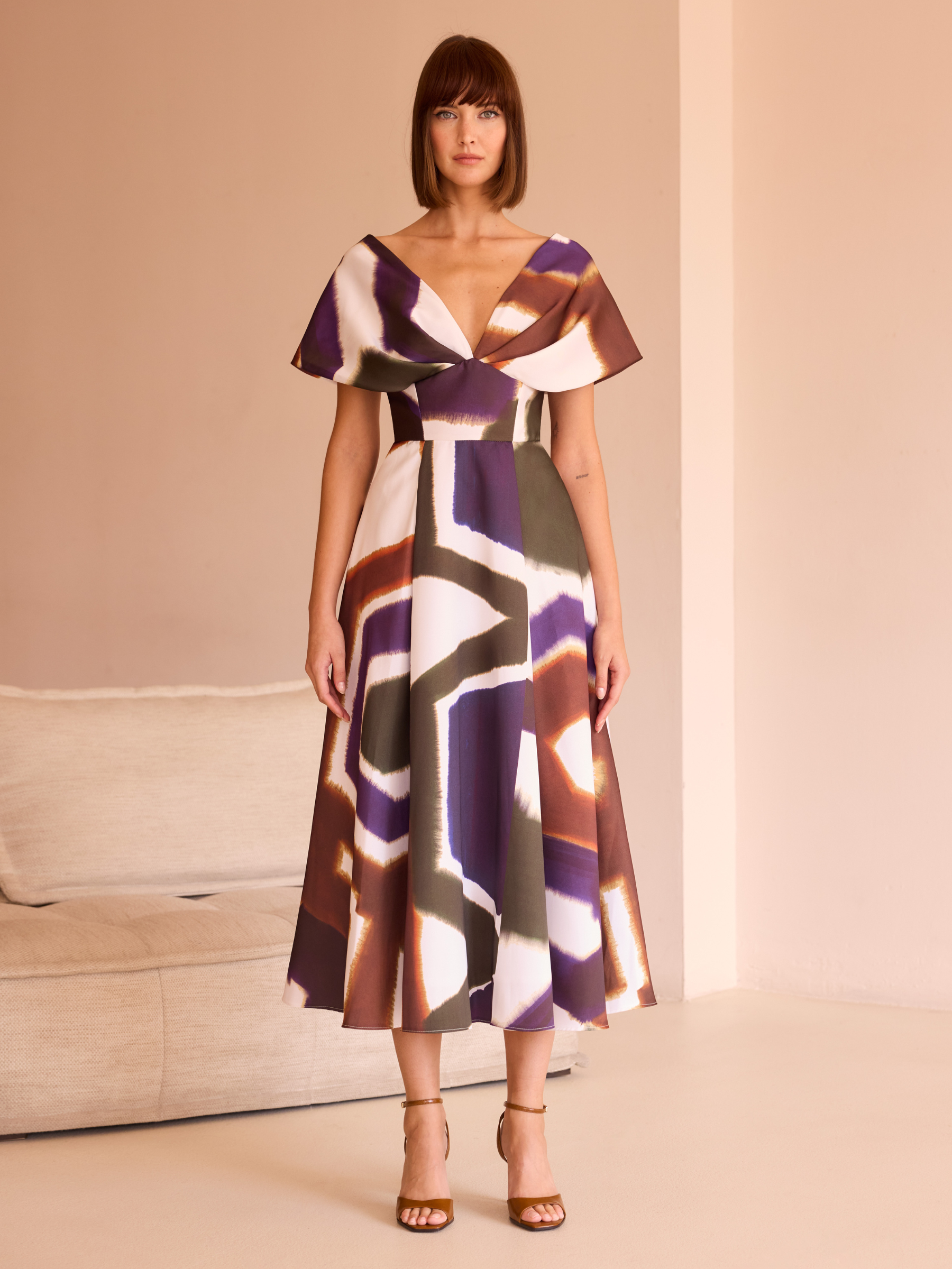 Carla Ruiz 52542 Brown Dress with abstract print, deep V-neckline, cape-effect sleeves and A-line midi skirt.