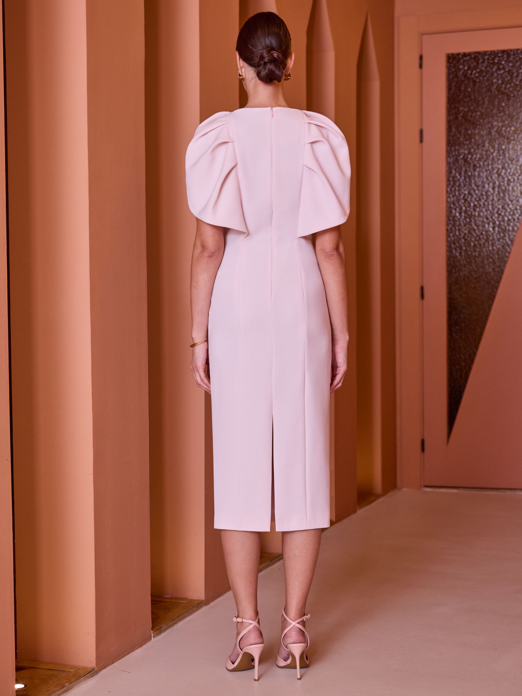 Carla Ruiz 52554 Pink Dress with straight midi silhouette, square neckline and sculpted shoulder bows.