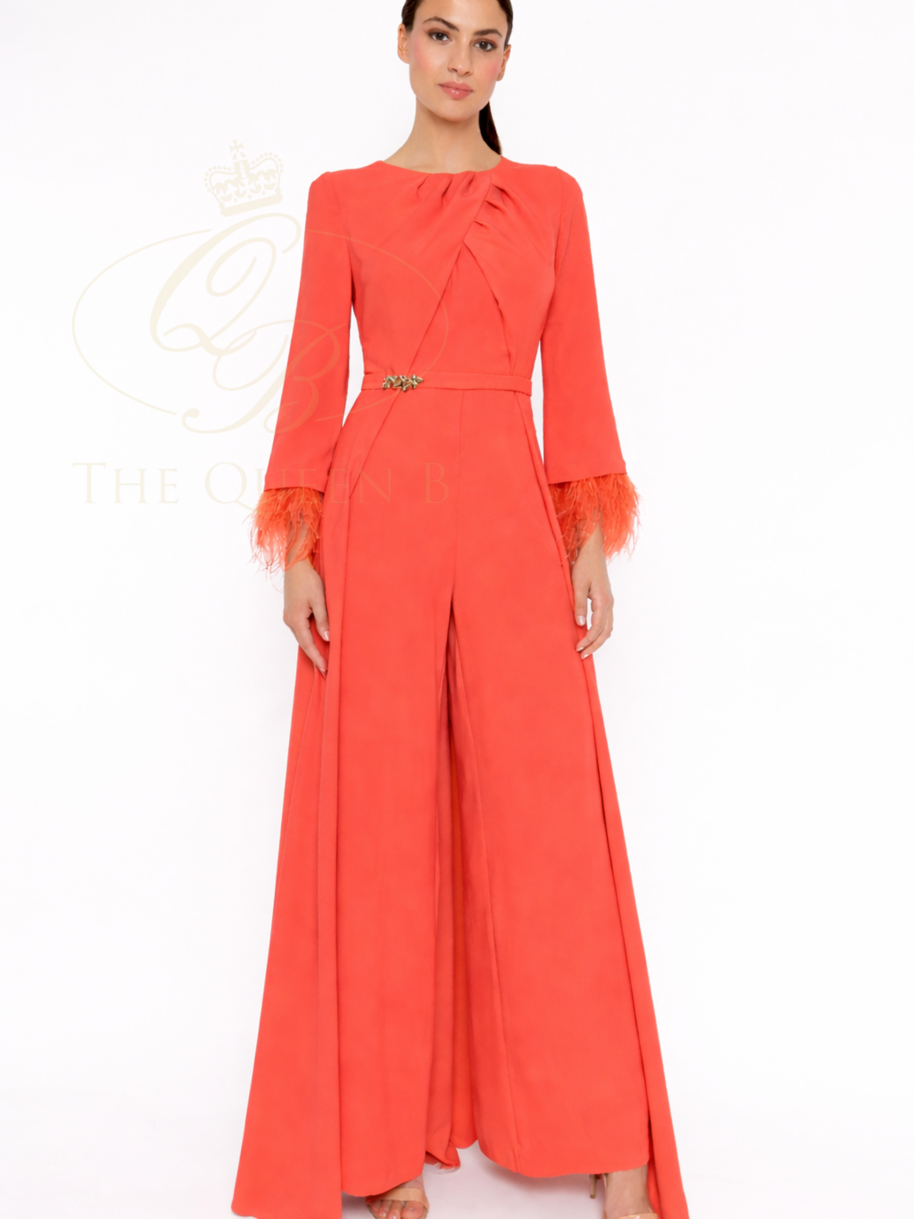 Carla Ruiz 52628 Orange jumpsuit with pleated neckline, feather trim cuffs and wide-leg trousers.