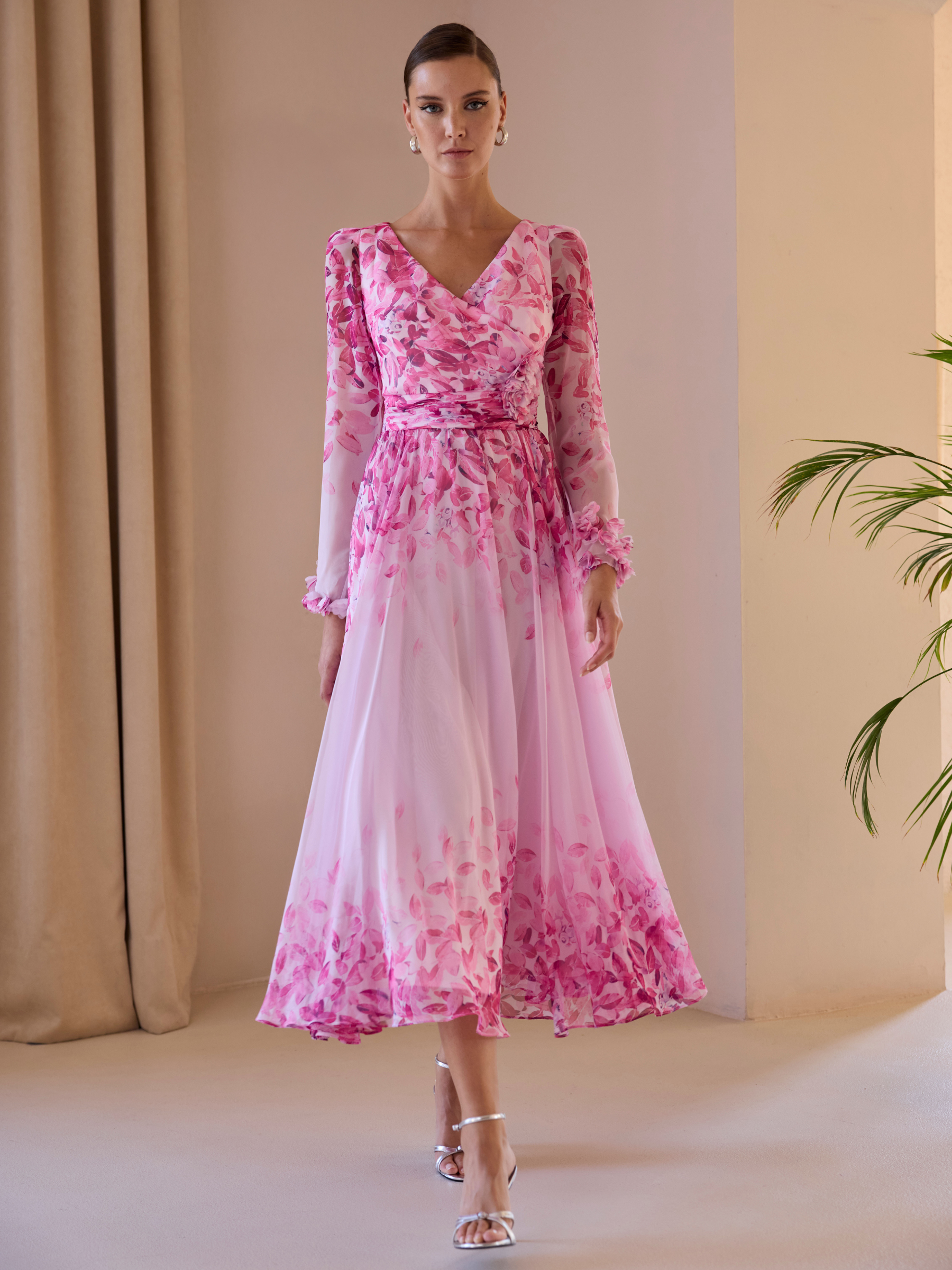 Carla Ruiz 52707 pink A-line dress with V-neckline, draped bodice, sheer long sleeves and flowing skirt.