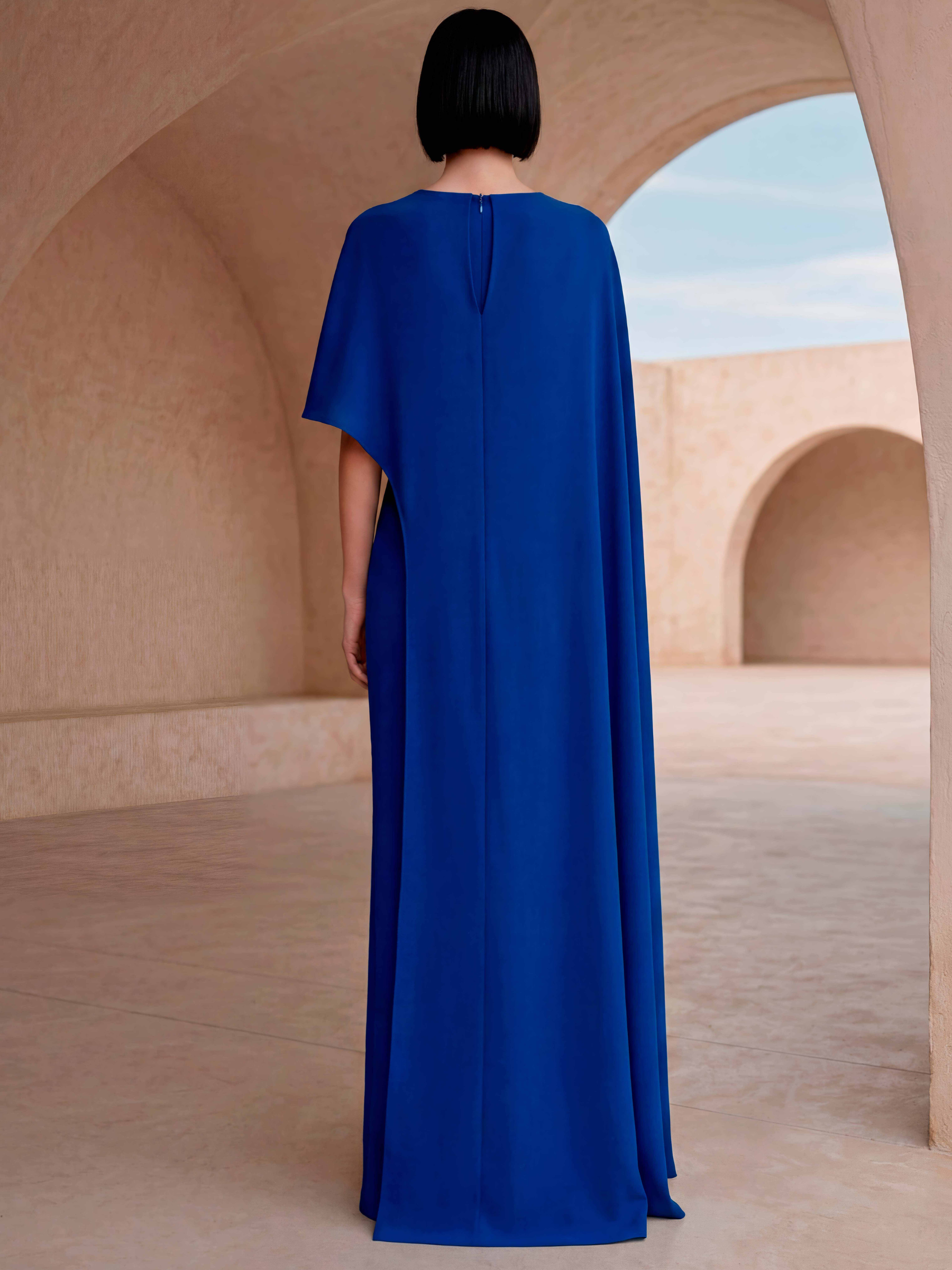 Carla Ruiz 53042 Blue full-length dress with asymmetric neckline, cape overlay and front split