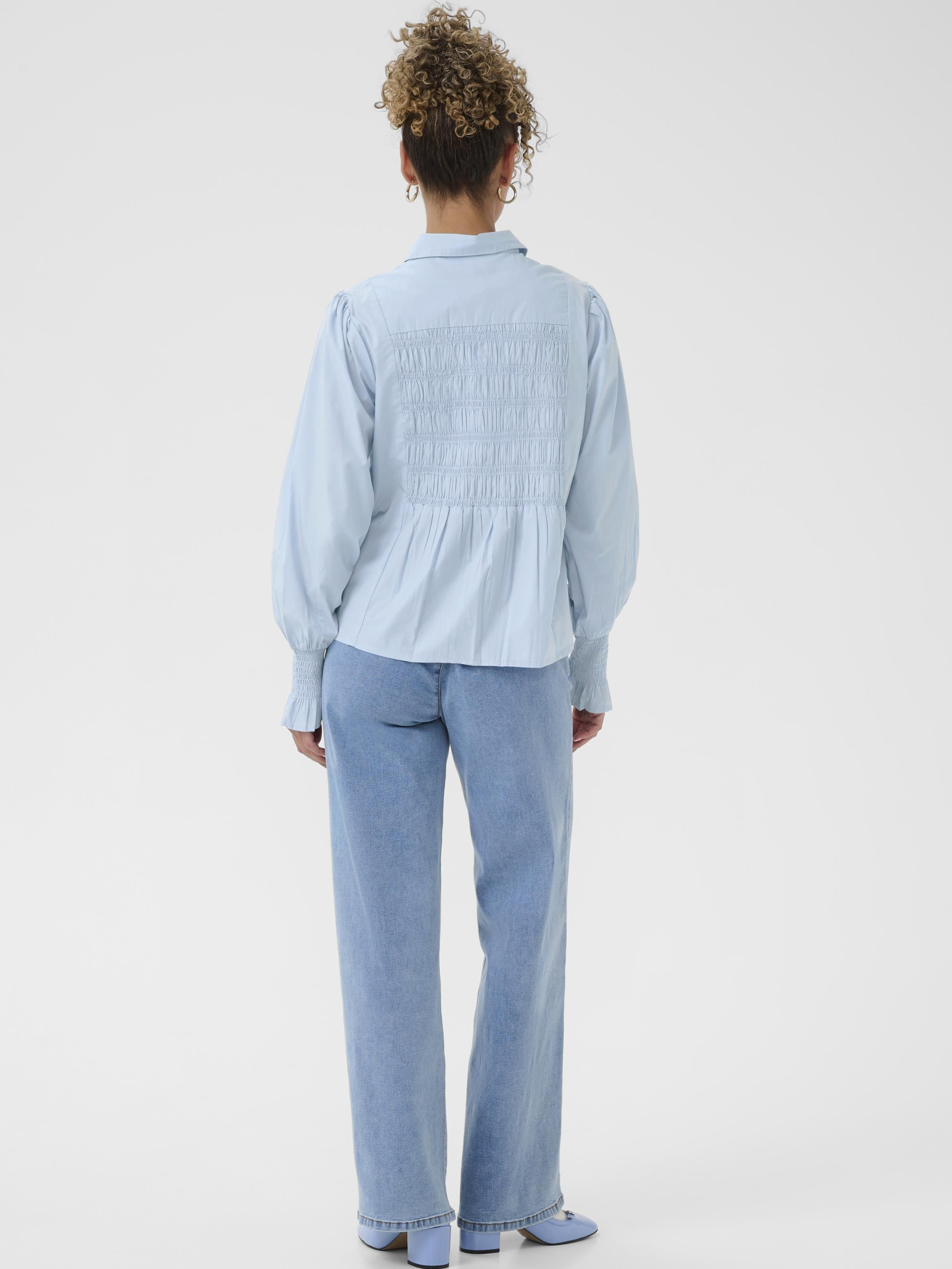 Cream Adeline Shirt women’s regular fit long sleeve shirt with smocked detailing, collared neckline and hip-length cut, styled with jeans.