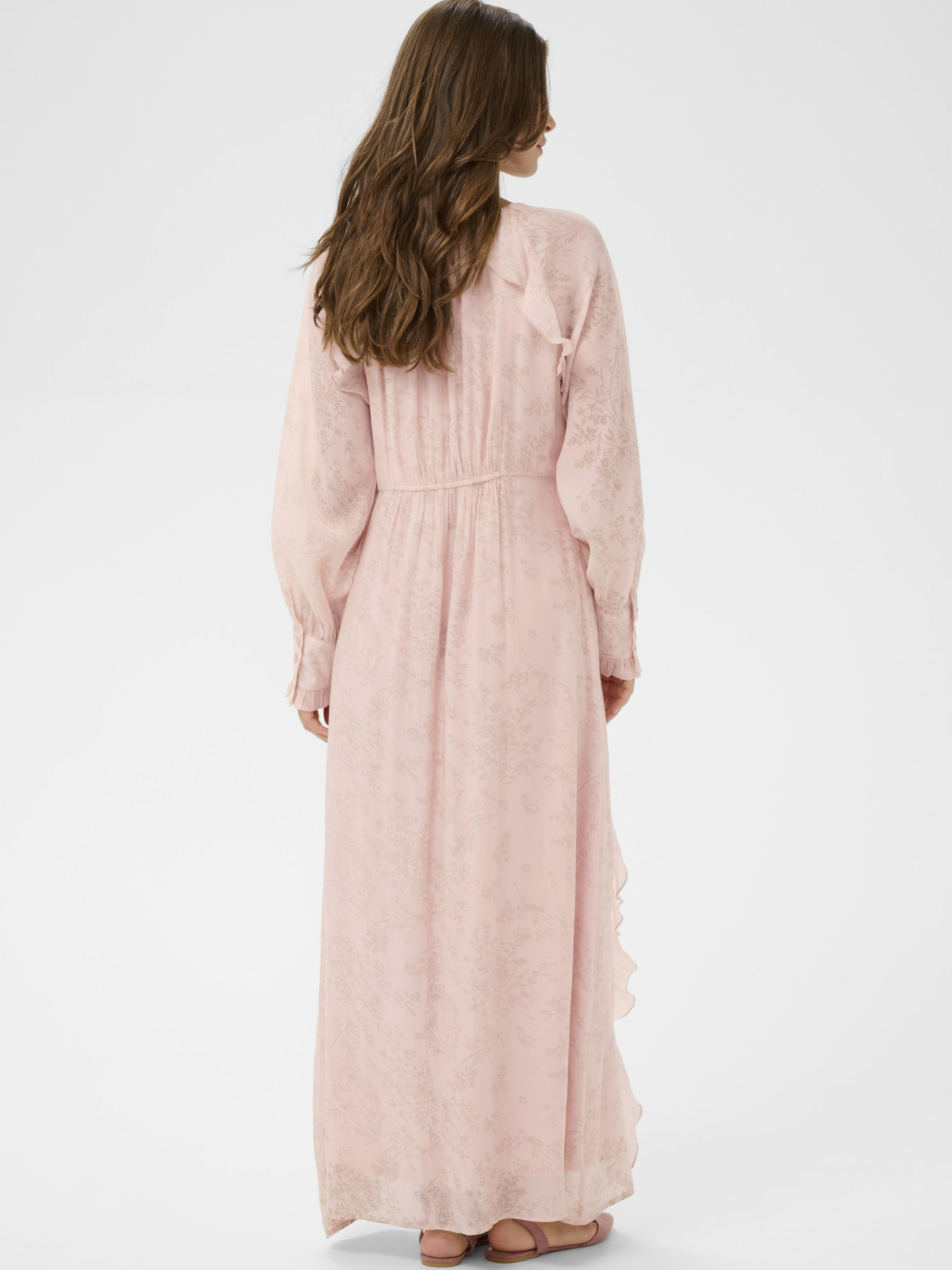 Cream Amy Dress full-length maxi dress with tie neckline and cascading ruffle detailing.