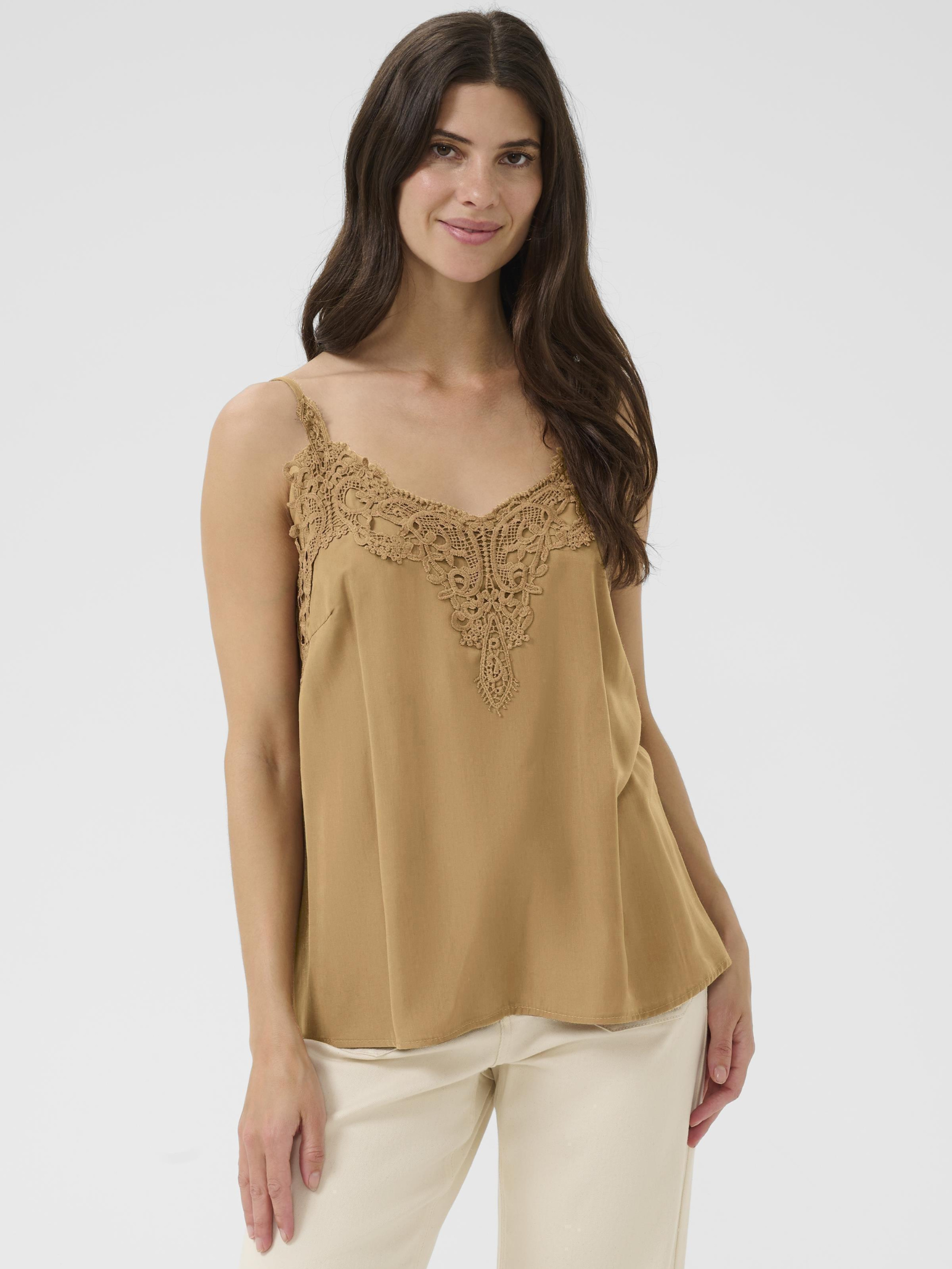 Cream Anna women’s A-line camisole top with lace neckline detail, adjustable straps and hip-length fit, styled with jeans.