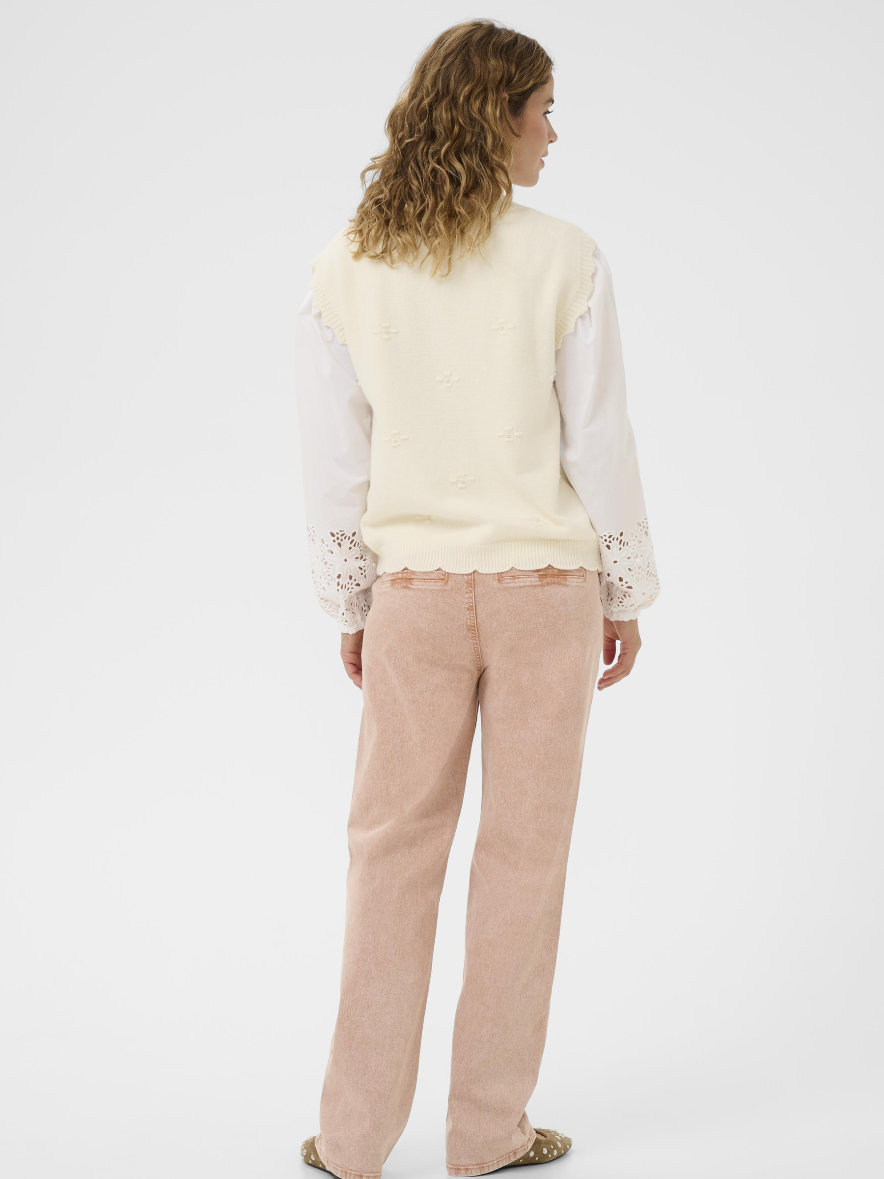 Cream Avie Knit Slipover women’s loose-fit hip-length sleeveless knit with soft textured fabric.