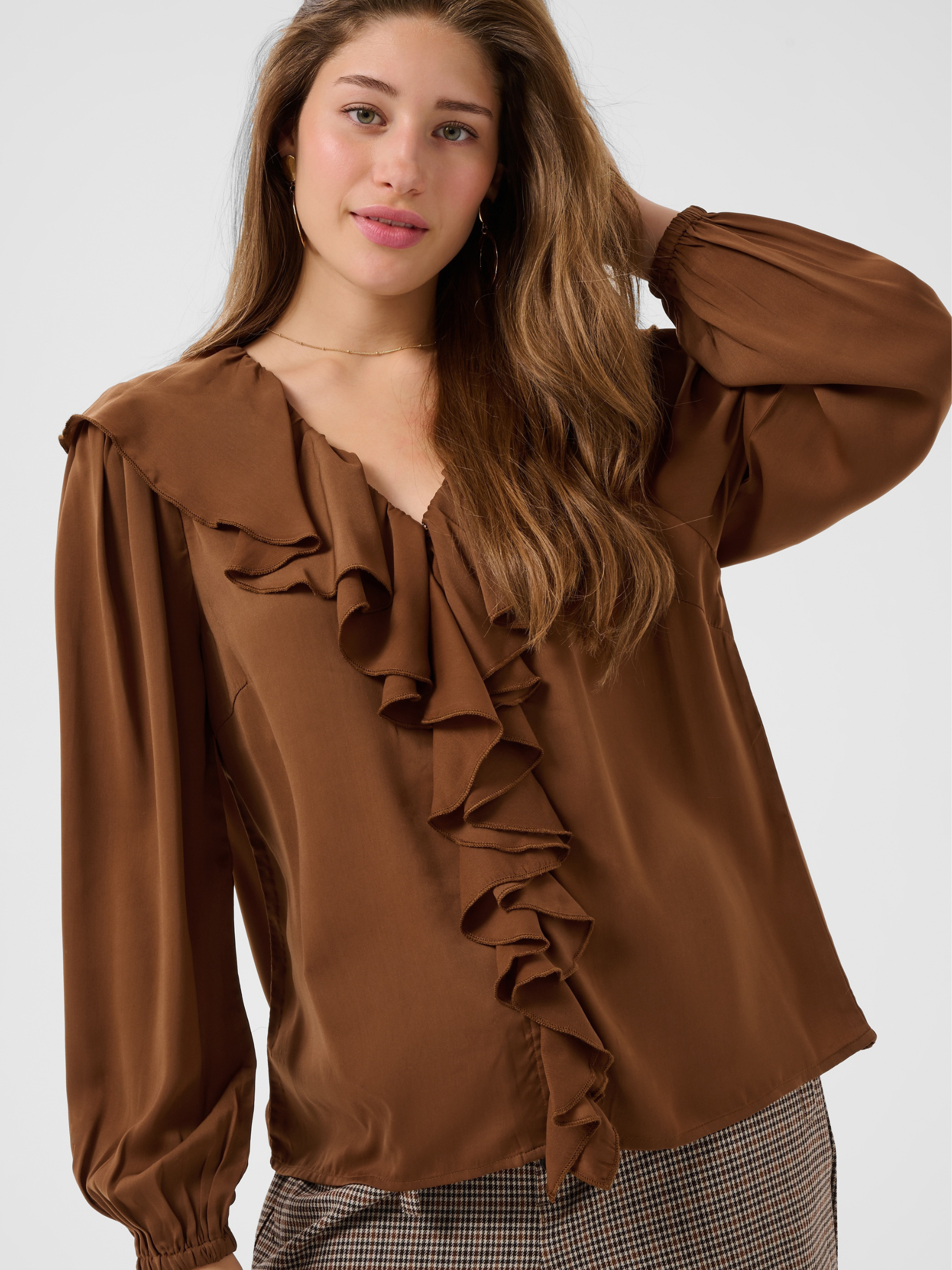 Cream Beliv Blouse with ruffle front detailing and long sleeves in a lightweight fabric.