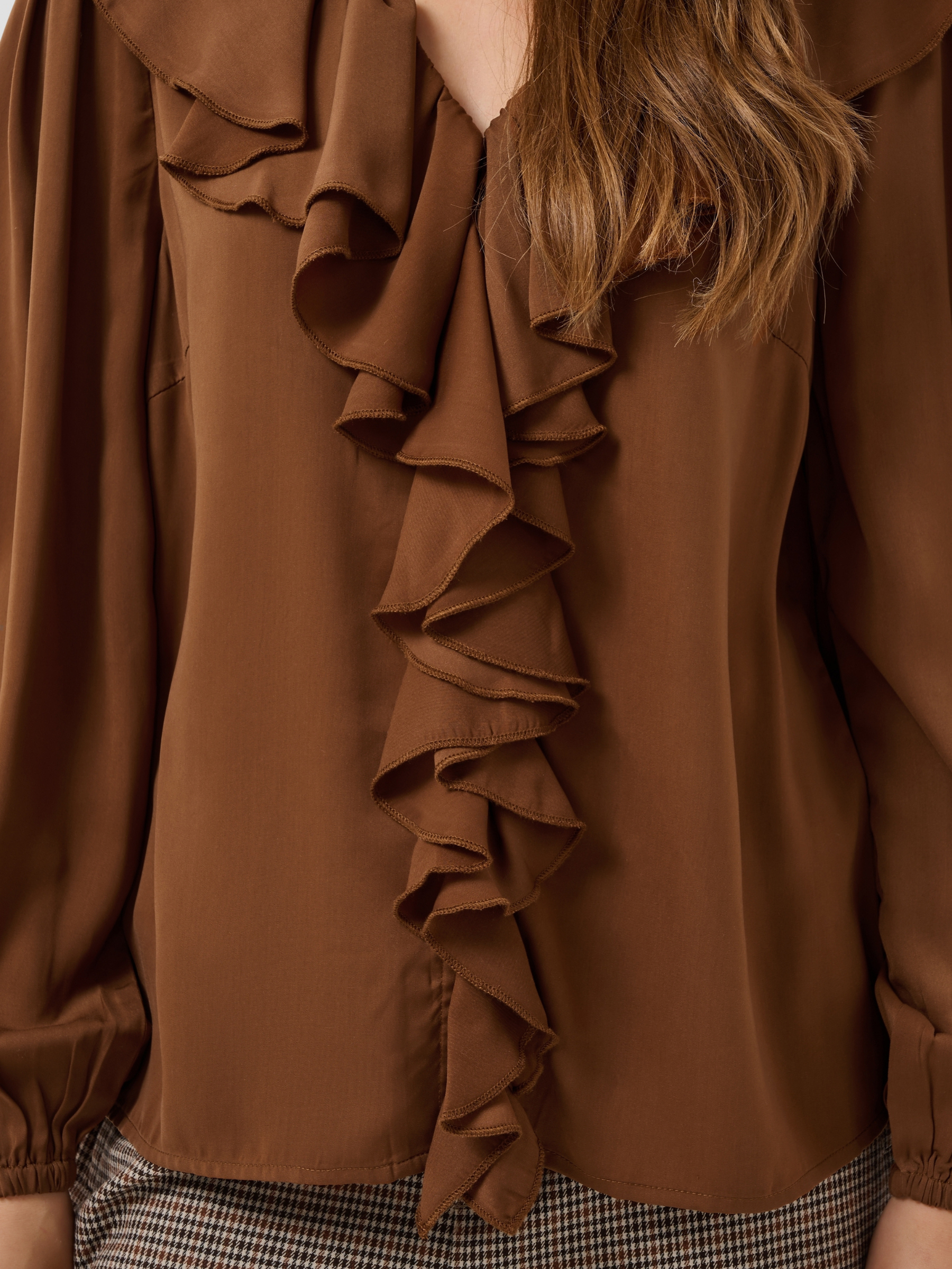 Cream Beliv Blouse with ruffle front detailing and long sleeves in a lightweight fabric.