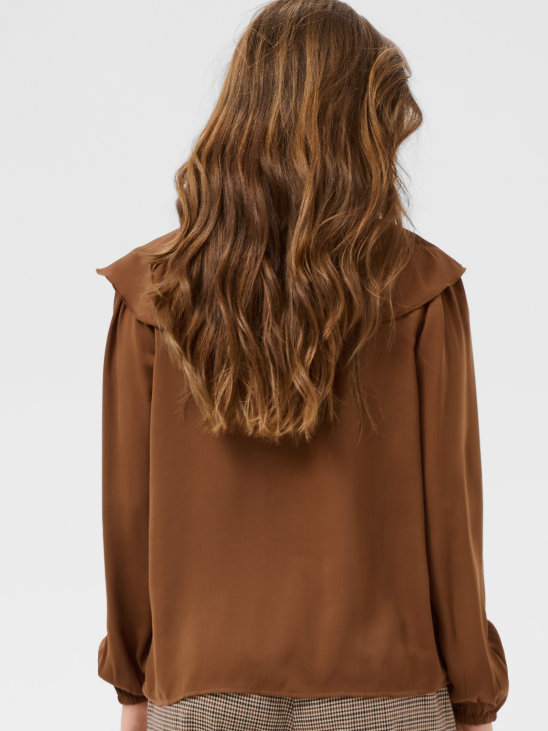 Cream Beliv Blouse with ruffle front detailing and long sleeves in a lightweight fabric.