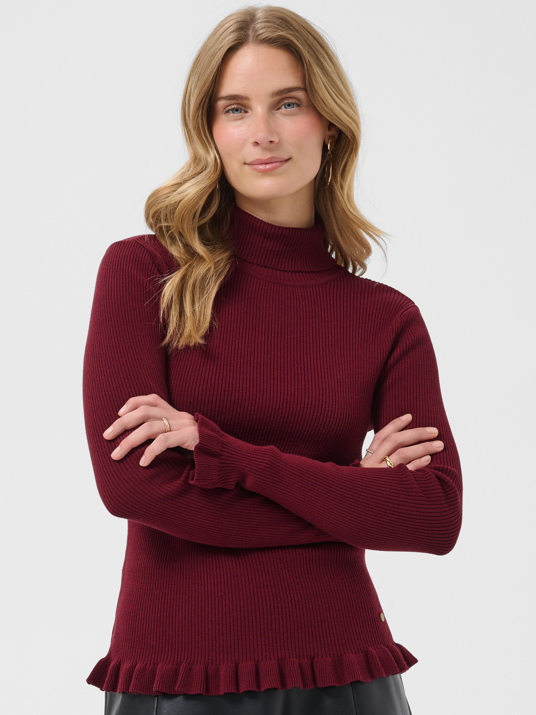 Cream Dela Roll Neck Knit with ribbed texture, roll neck, long sleeves, frill cuffs and hip-length fit