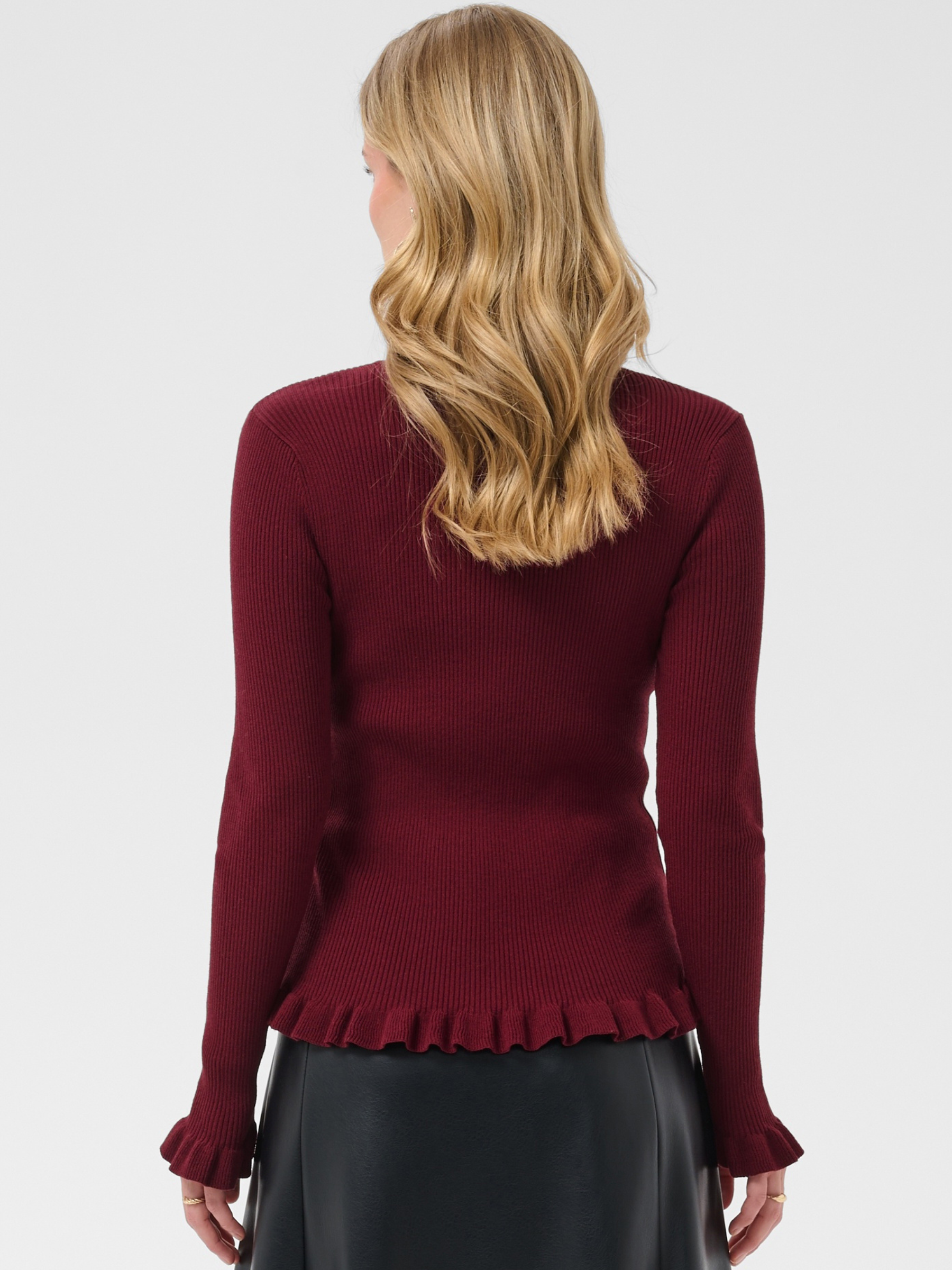 Cream Dela Roll Neck Knit with ribbed texture, roll neck, long sleeves, frill cuffs and hip-length fit