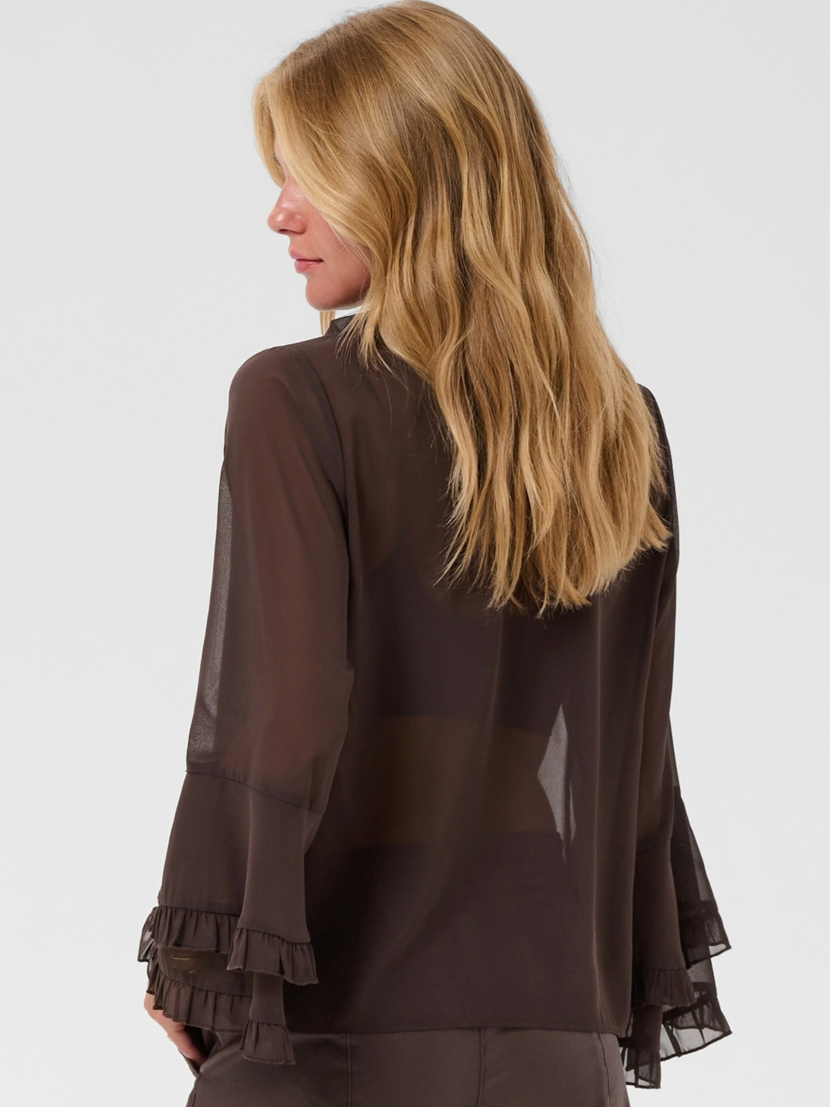 Cream Flouncy Blouse with ruffle neckline, button front and layered flared sleeves.