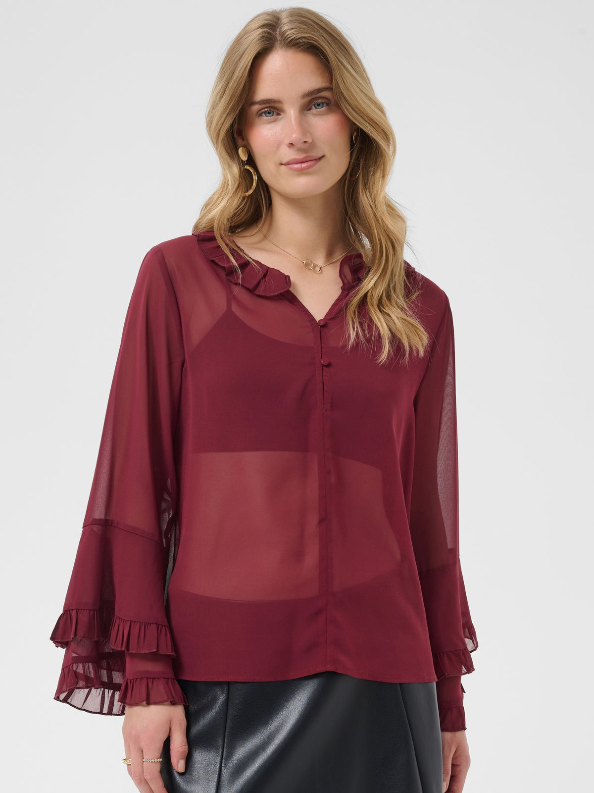 Cream Flouncy Blouse with ruffle neckline, button front and layered flared sleeves.