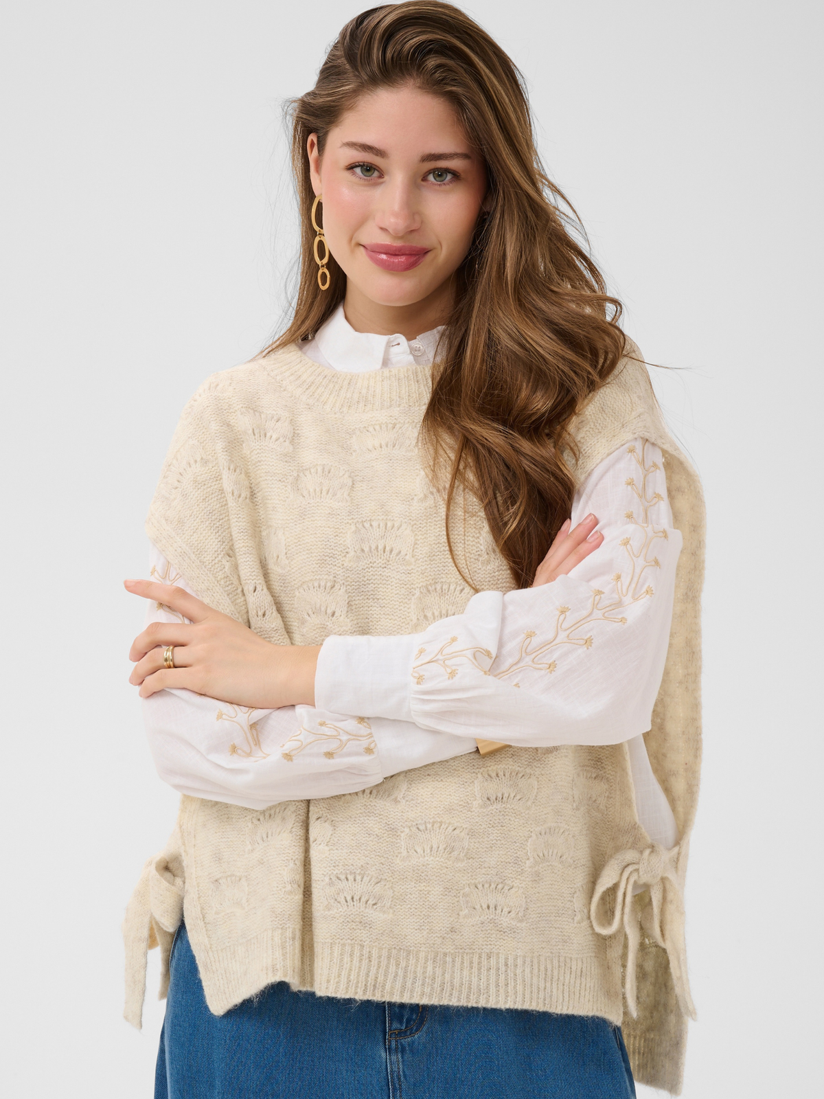 Cream Haggie Knit Slipover with textured knit design, sleeveless shape and tie side detail