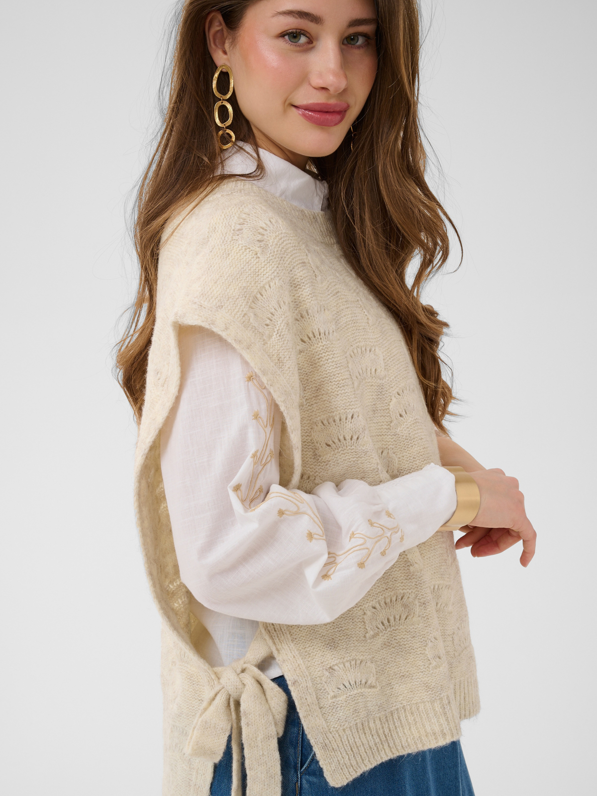 Cream Haggie Knit Slipover with textured knit design, sleeveless shape and tie side detail