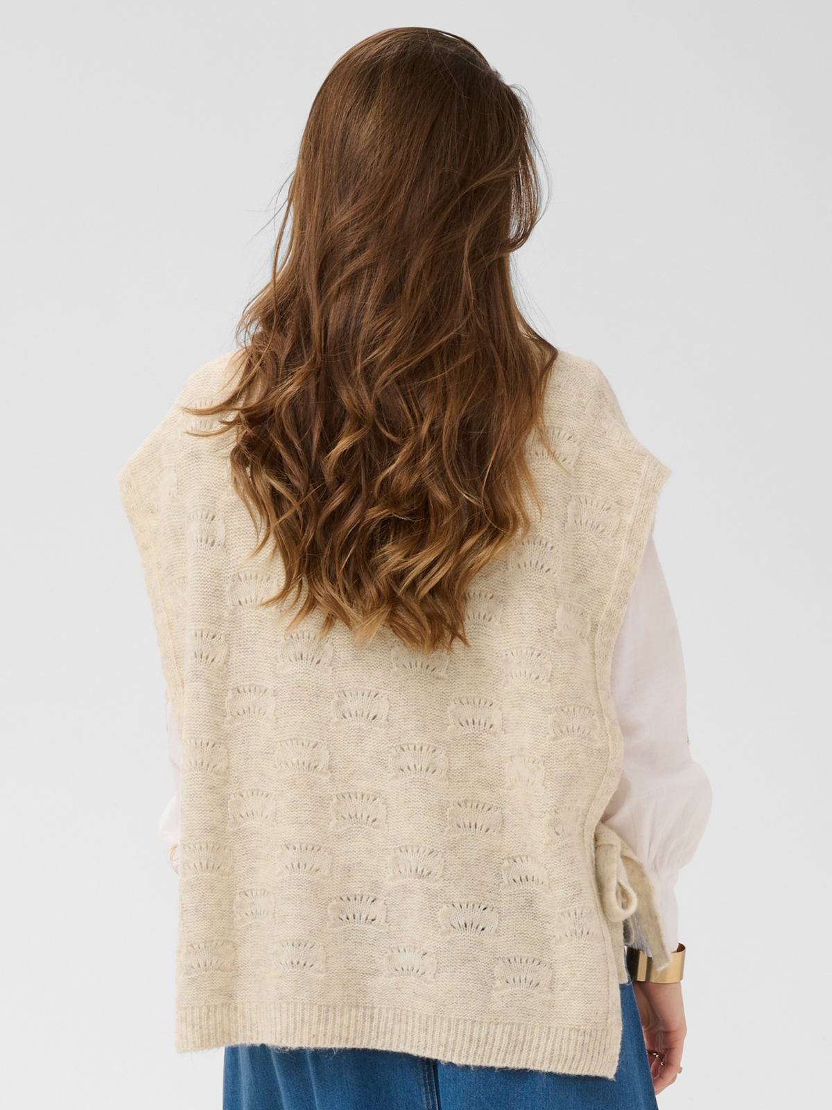 Cream Haggie Knit Slipover with textured knit design, sleeveless shape and tie side detail