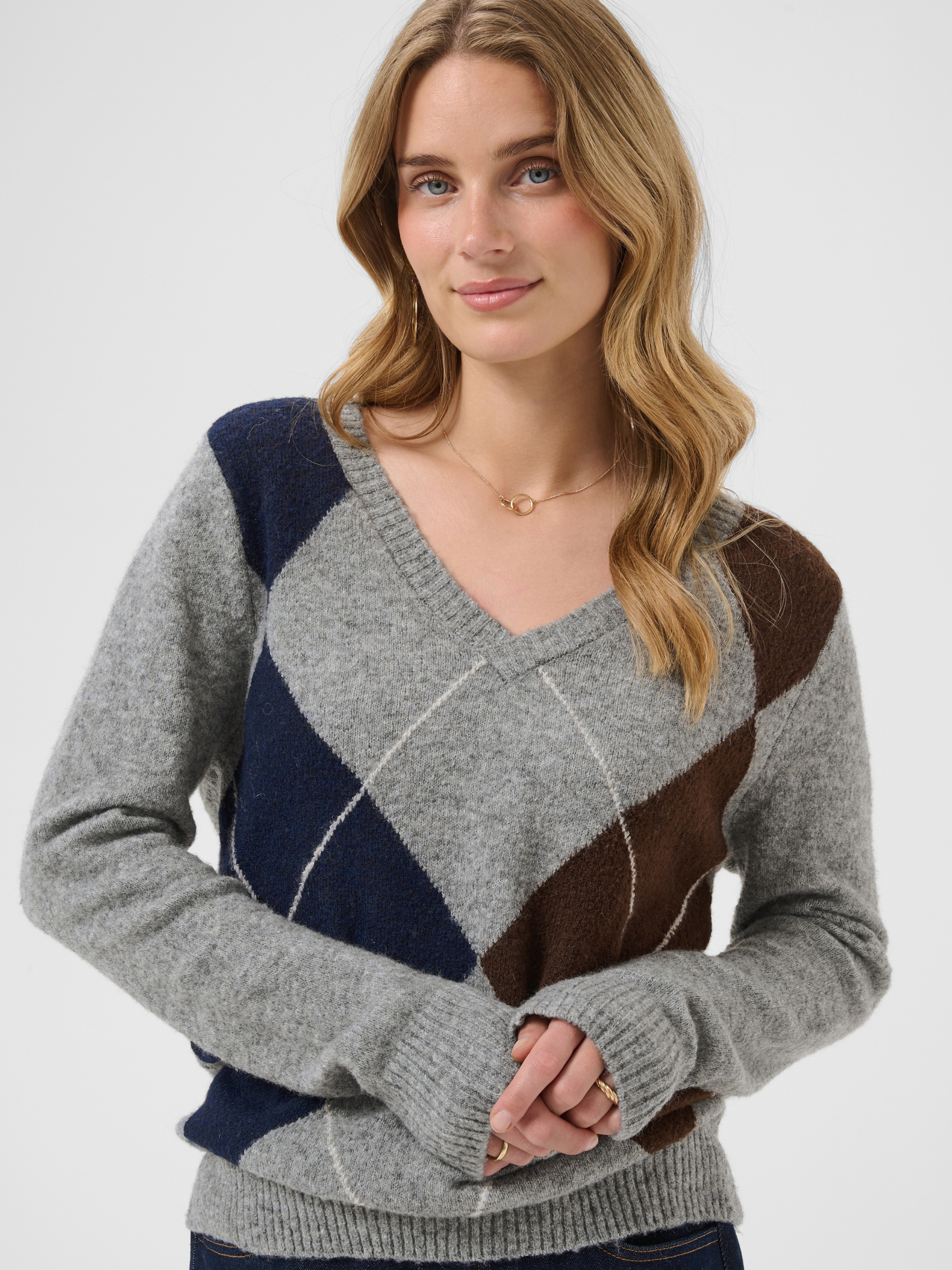 Cream Hope Knit Pullover with V-neckline, diamond pattern, long sleeves and ribbed cuffs