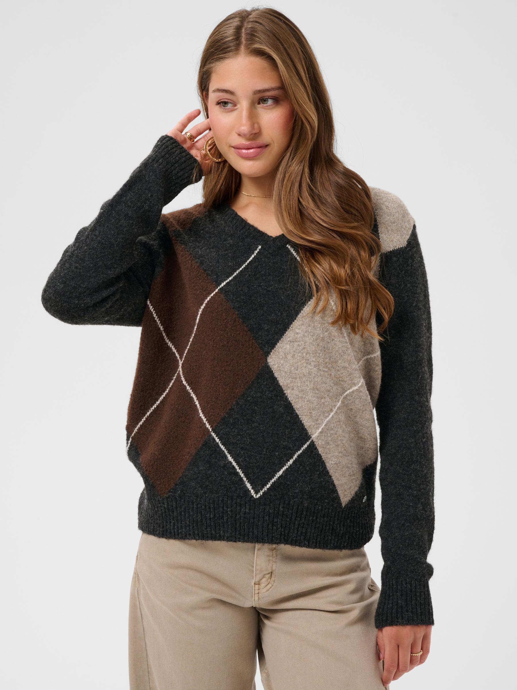 Cream Hope Knit Pullover with V-neckline, diamond pattern, long sleeves and ribbed cuffs