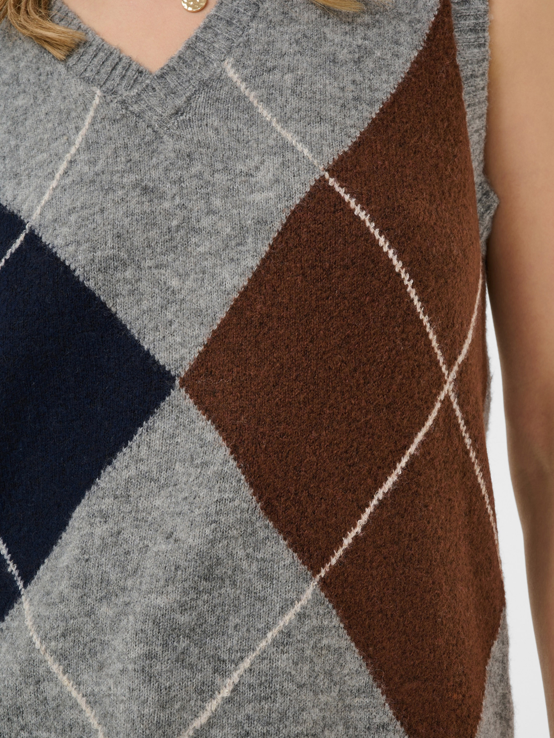 Cream Hope Knit Slipover with V-neckline, sleeveless shape, argyle-style pattern and ribbed trims
