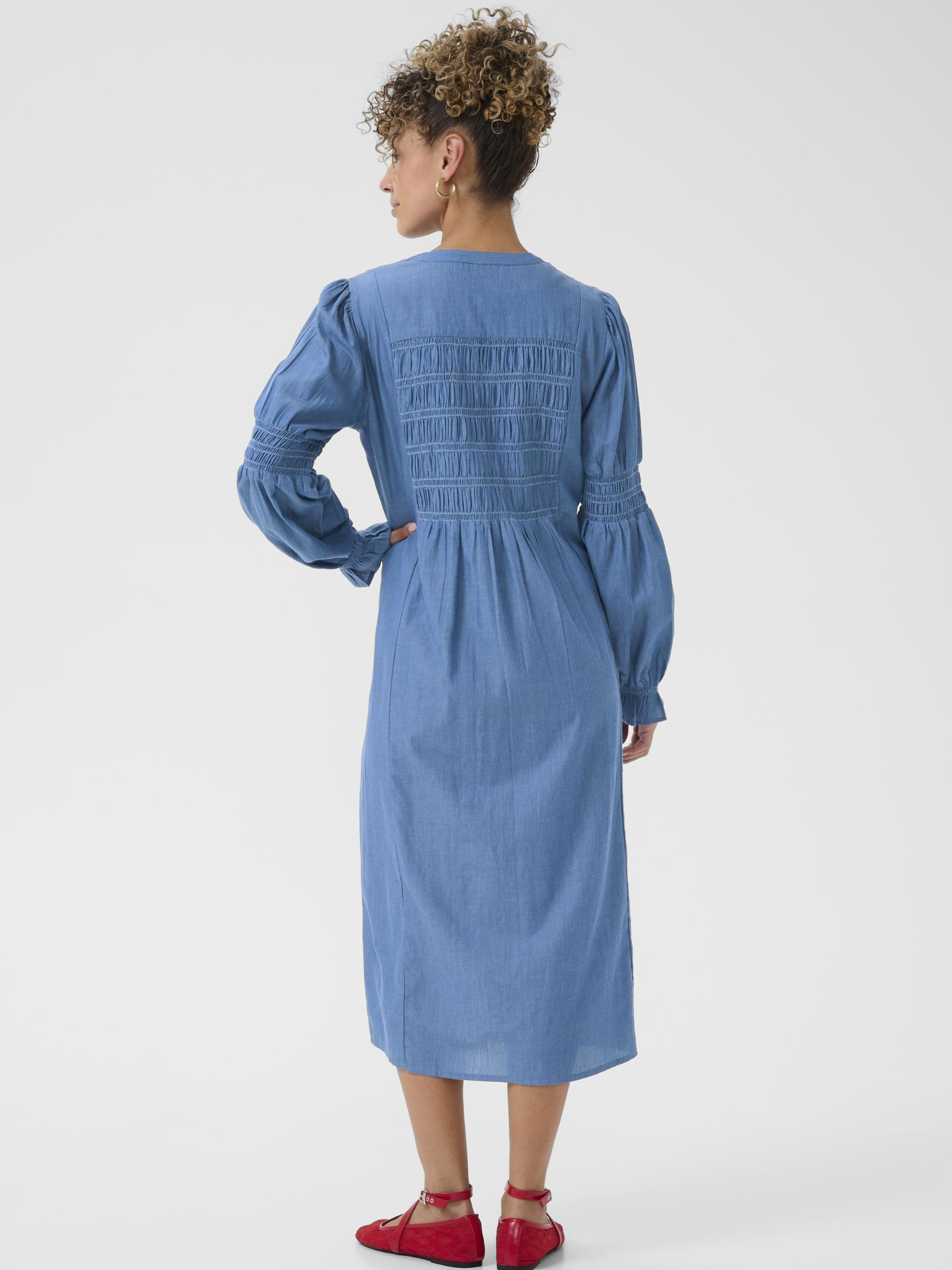 Cream Kami Dress women’s cotton midi dress with straight fit, round neckline, button-through front and long sleeves, styled with flat shoes.