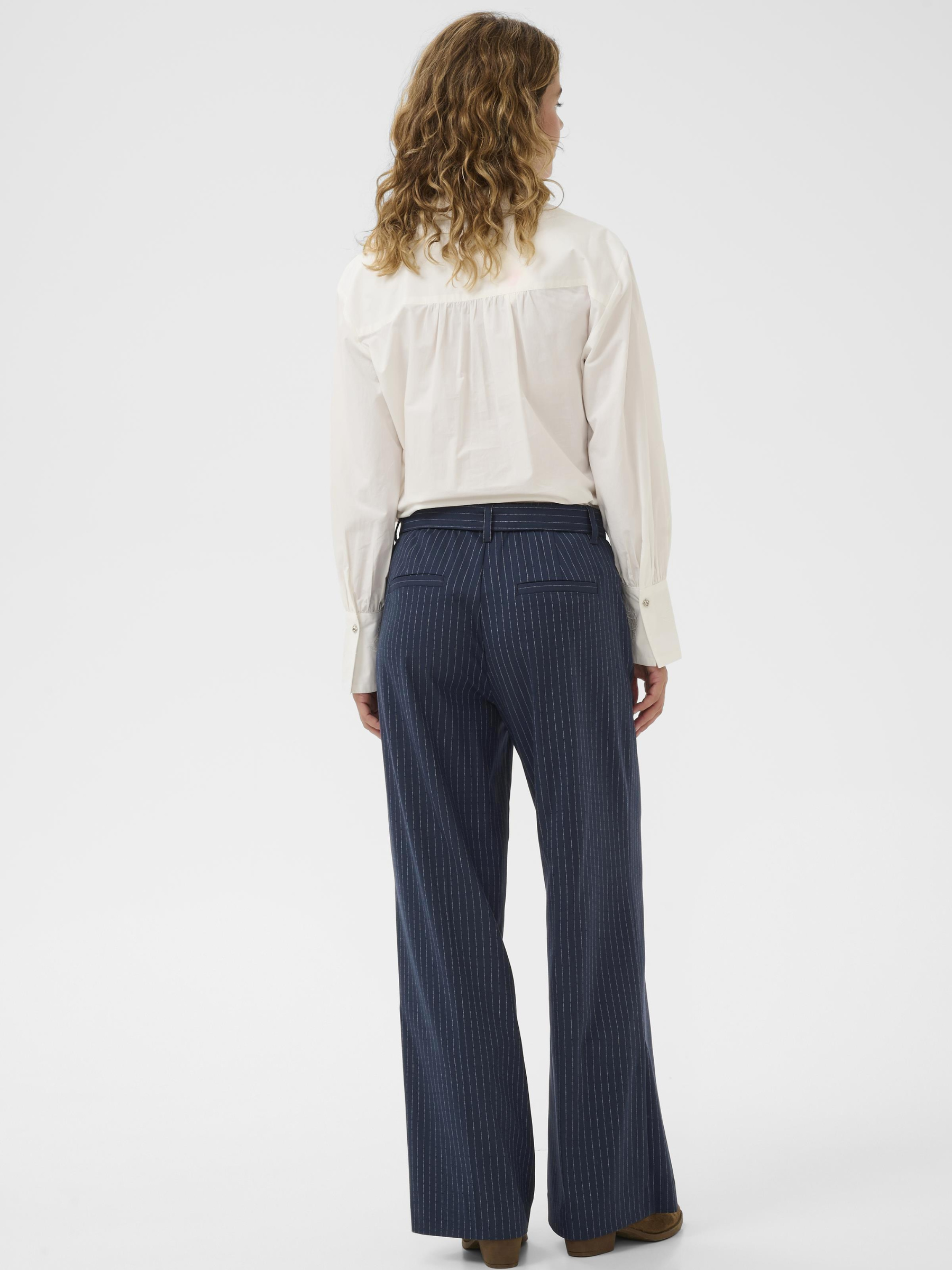 Cream Lorelie Pant women’s high-waist straight-leg tailored trousers with full-length fit and structured twill fabric, styled with a blouse.