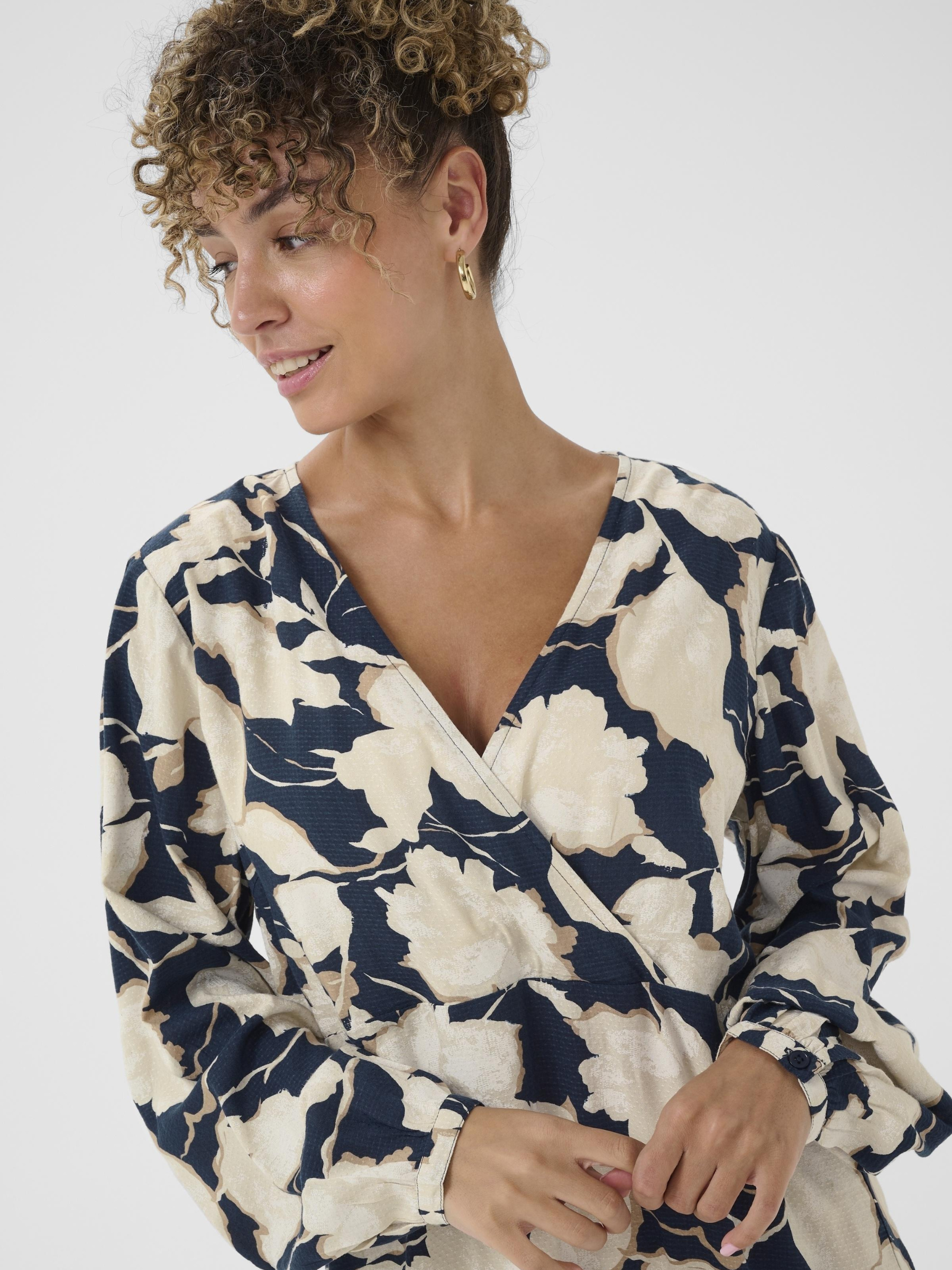 Cream Lucca Dress women’s A-line dress with Kim fit, wrap-style V-neckline and long sleeves for everyday and occasion wear.