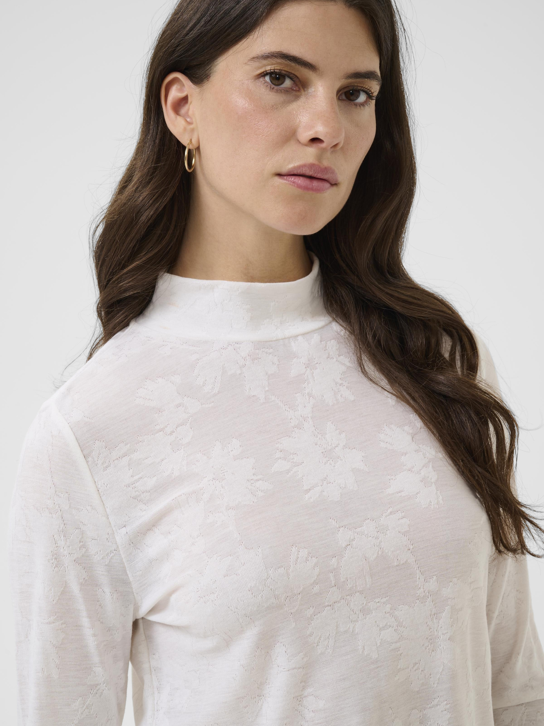Cream Olive Turtleneck women’s long sleeve turtleneck top with hip-length fit, soft stretch fabric and lightweight feel for everyday wear and layering.