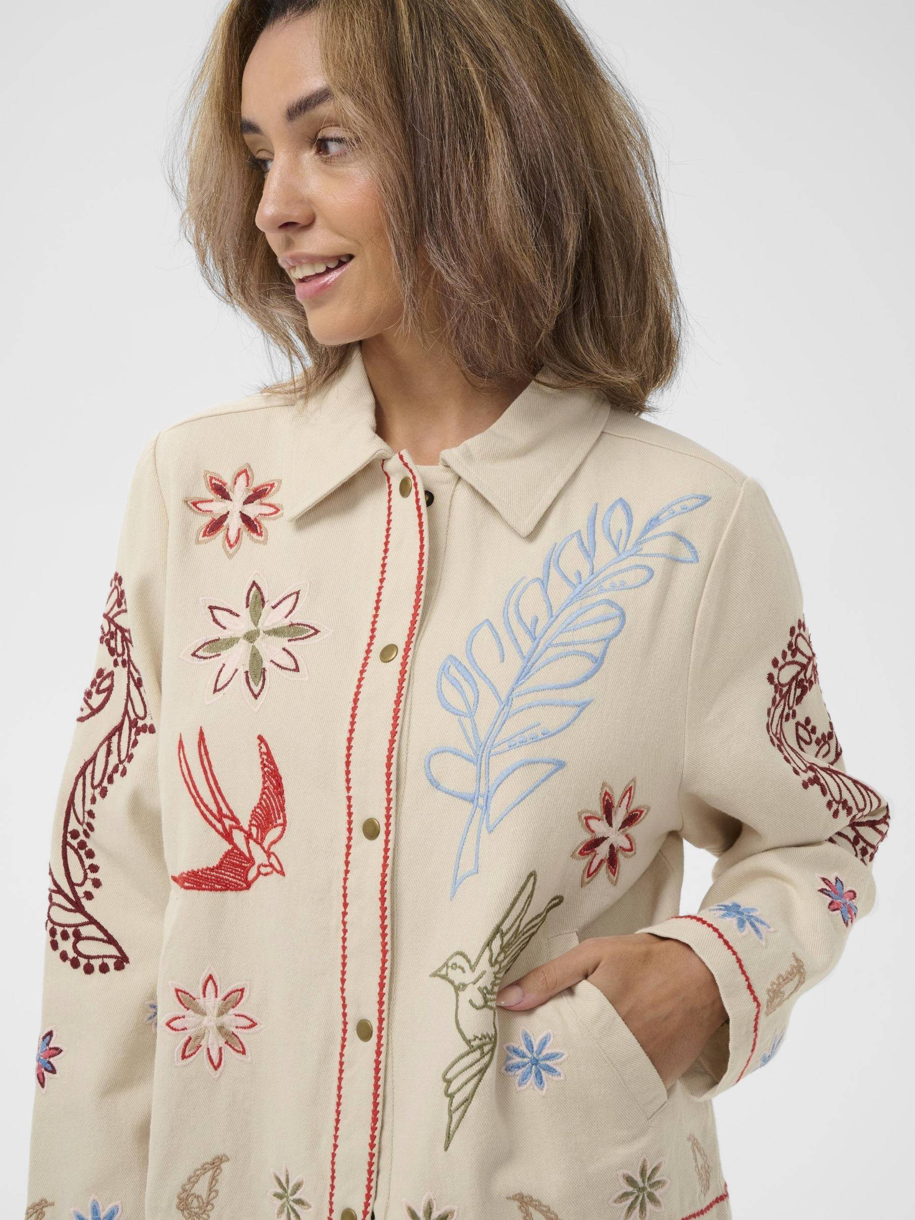Cream Rosetta Jacket with multicolour embroidered detailing and button-through front in cotton fabric.