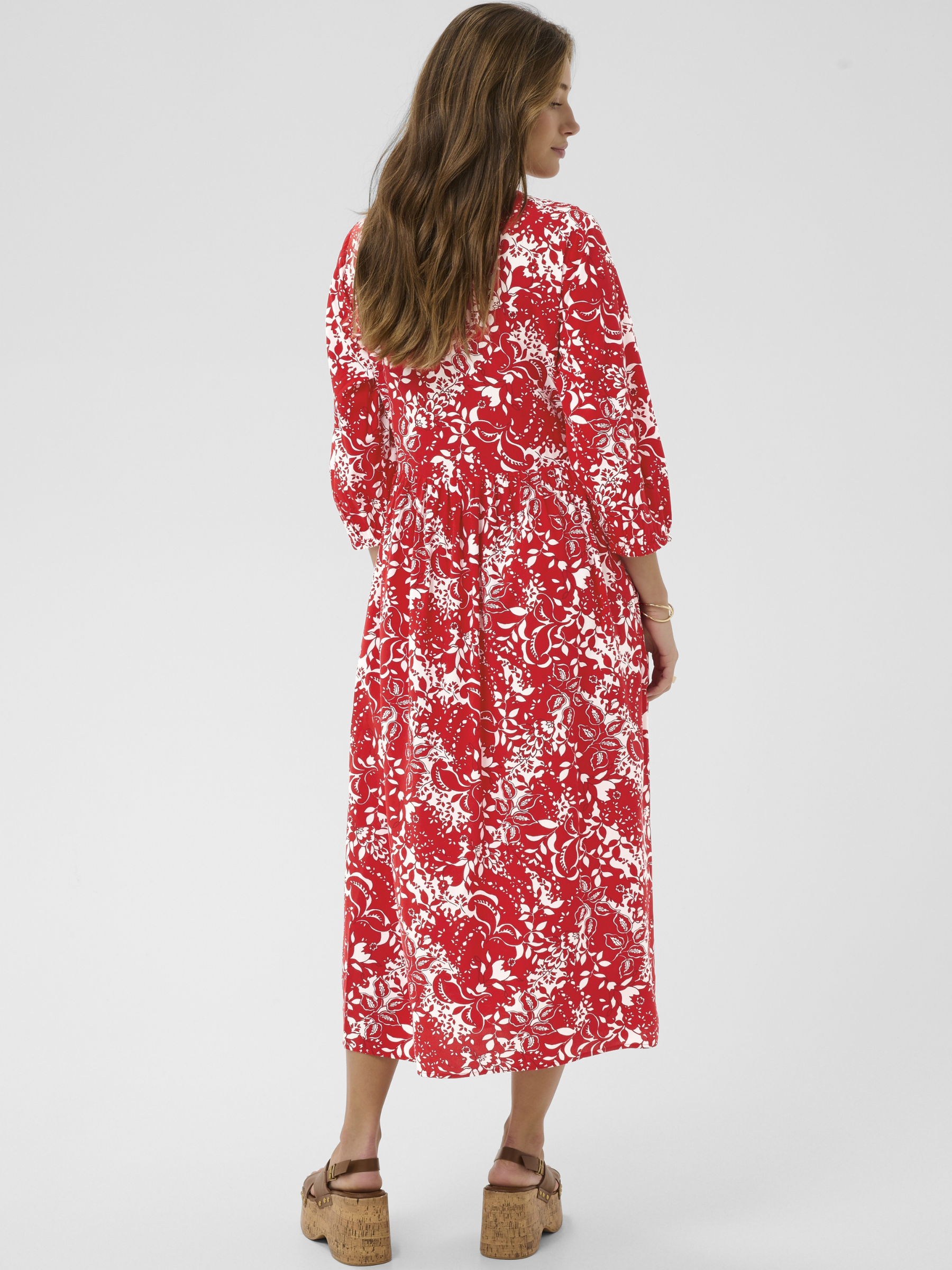 Cream Tiah Smock Dress printed midi dress with V-neckline, empire waist and three-quarter sleeves.