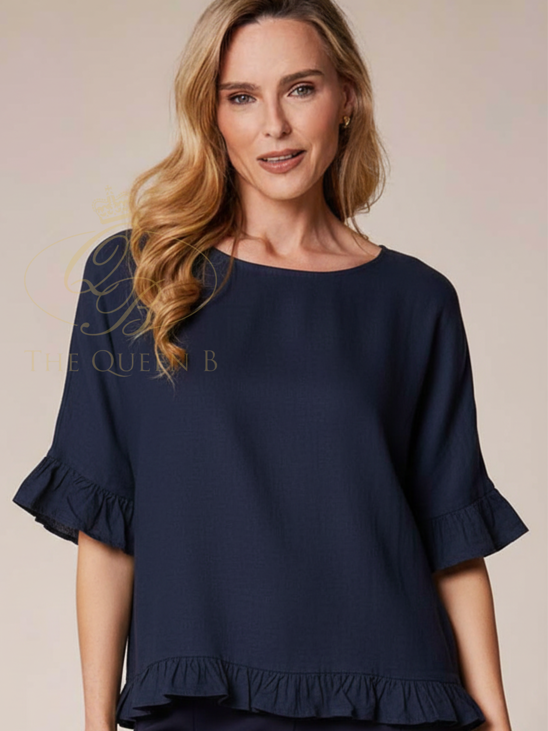 Deck By Decollage 13061 Frill Top with frill sleeve and hem detail.