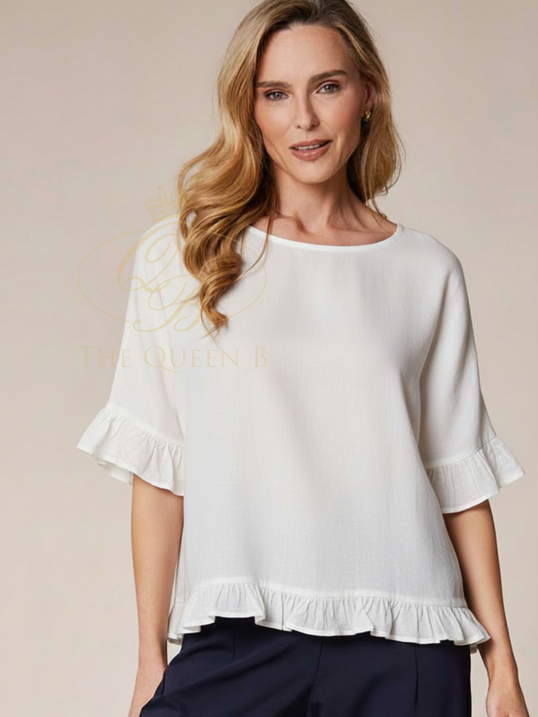 Deck By Decollage 13061 Frill Top with frill sleeve and hem detail.