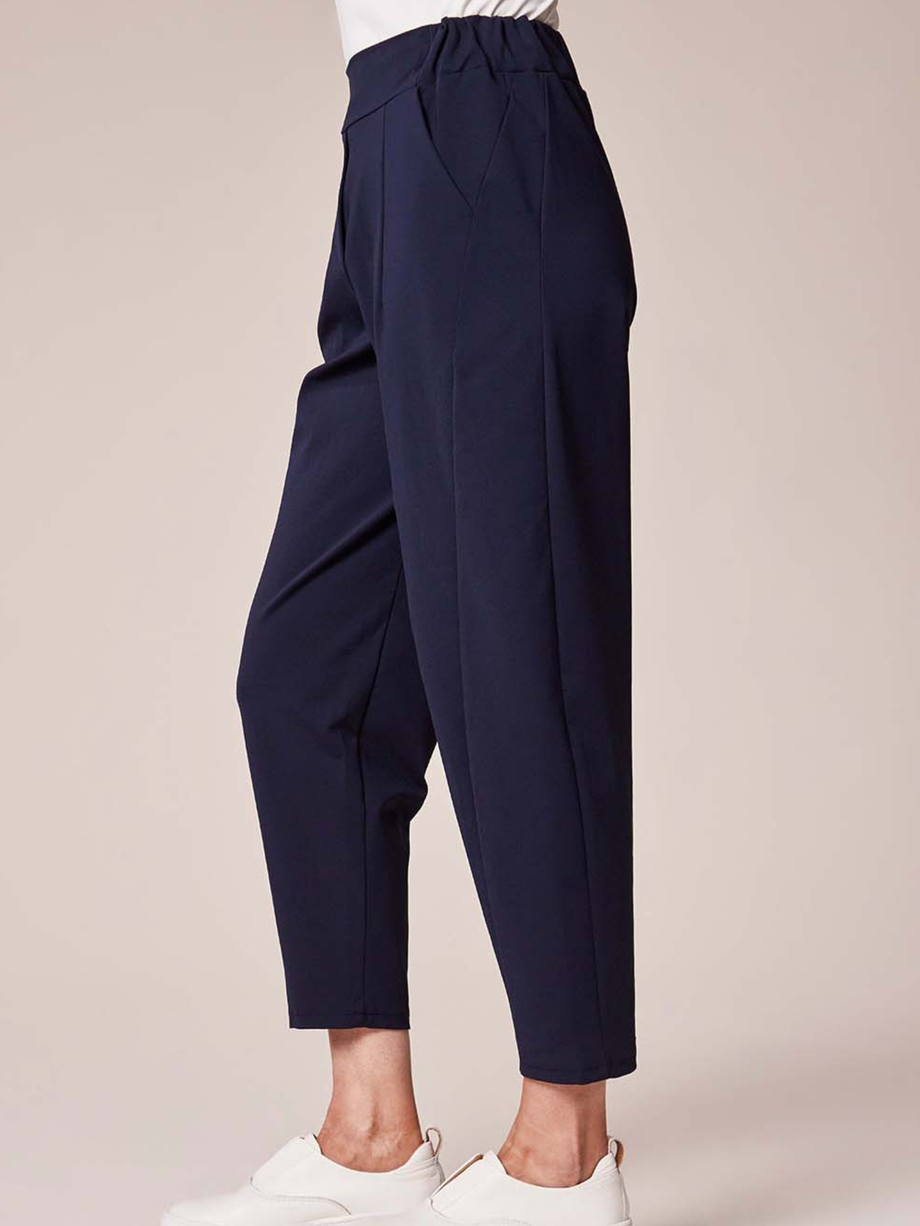 Deck By Decollage 2511 tapered tailored trousers with high-rise waistband and cropped ankle-length finish.