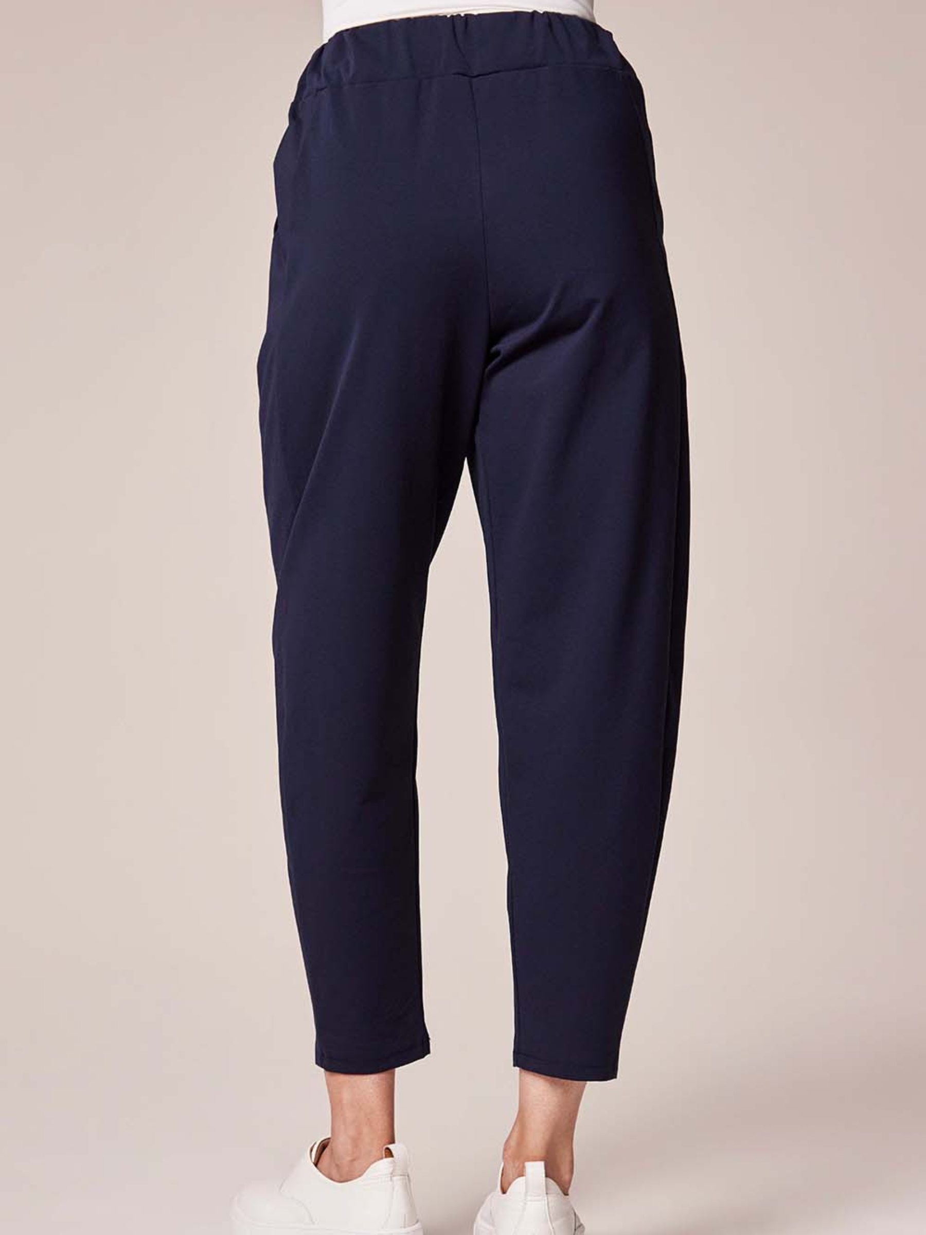 Deck By Decollage 2511 tapered tailored trousers with high-rise waistband and cropped ankle-length finish.