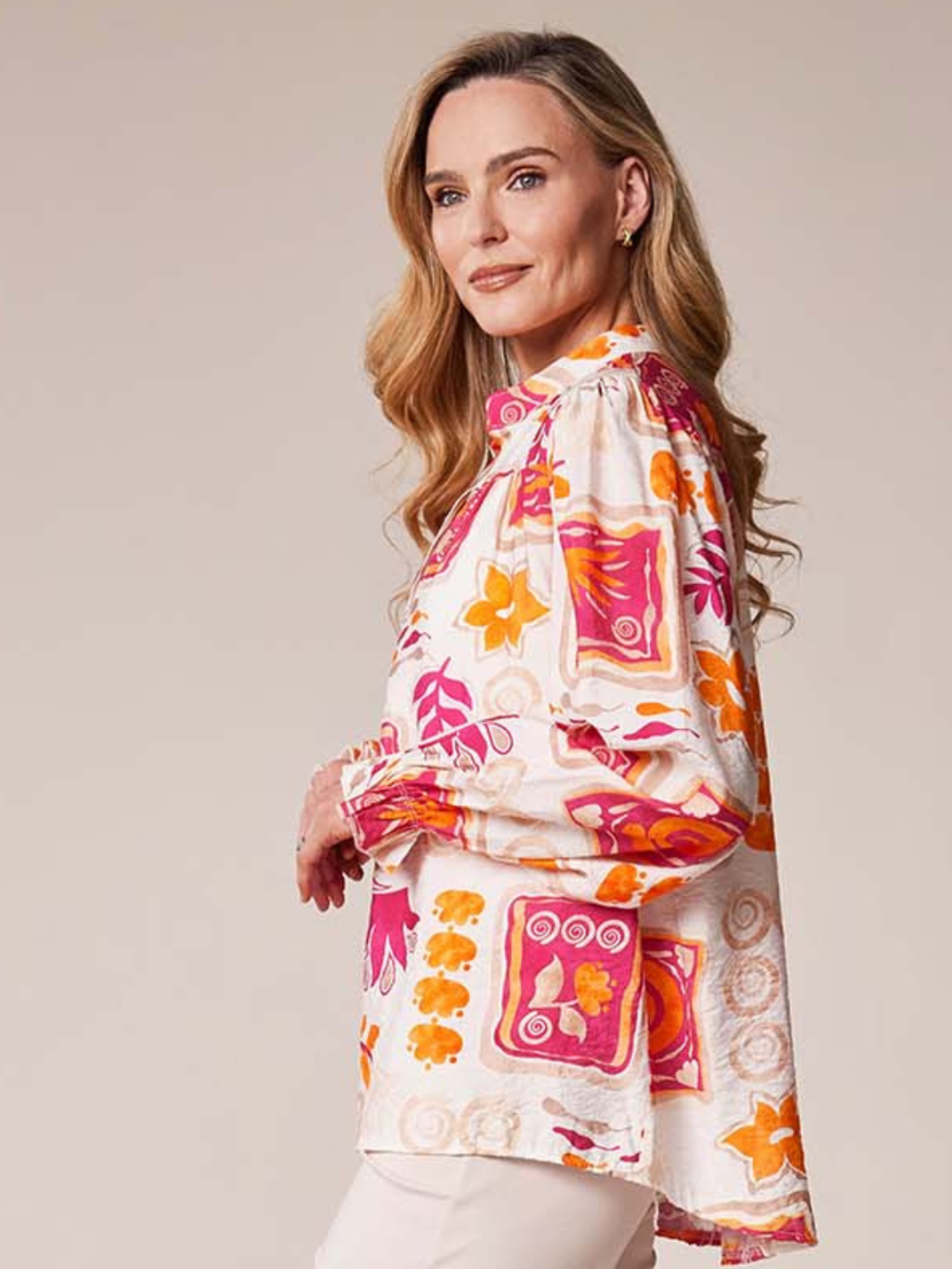 Deck By Decollage MC18022S printed blouse with notch neckline and long sleeves in lightweight fabric.