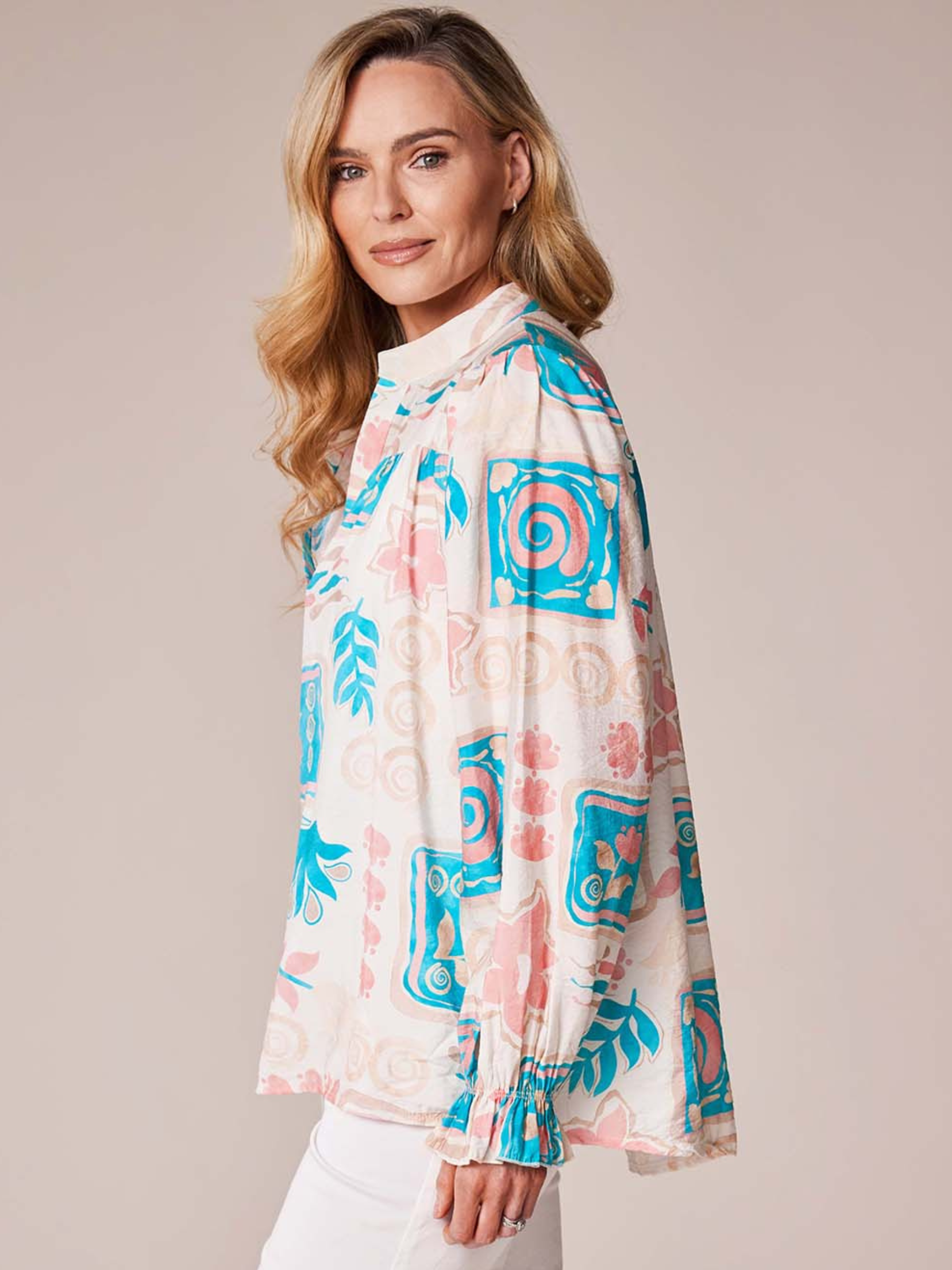 Deck By Decollage MC18022S printed blouse with notch neckline and long sleeves in lightweight fabric.